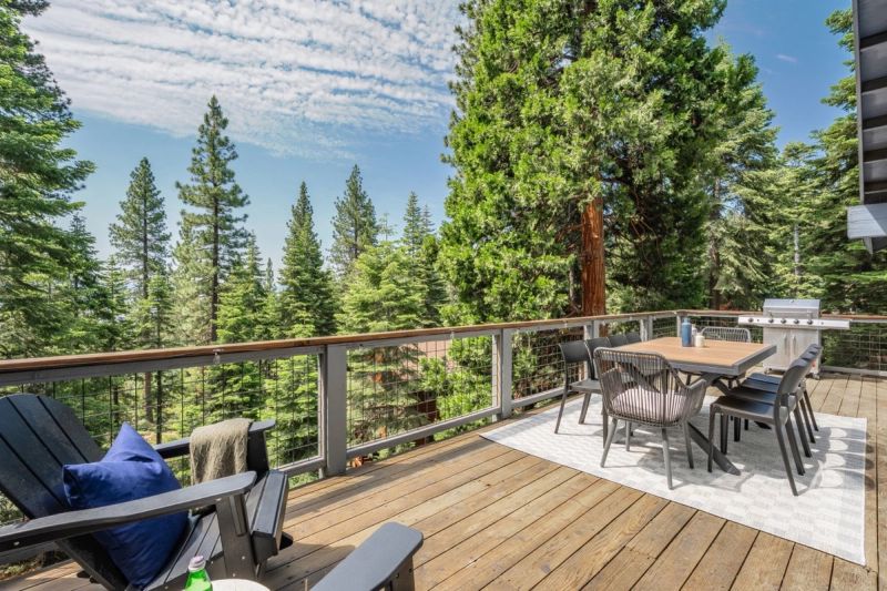Outdoor dining on the deck among the pines
