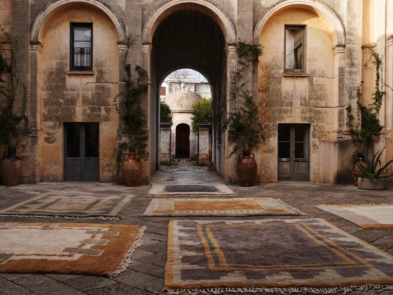 Mixed rugs in courtyard. 