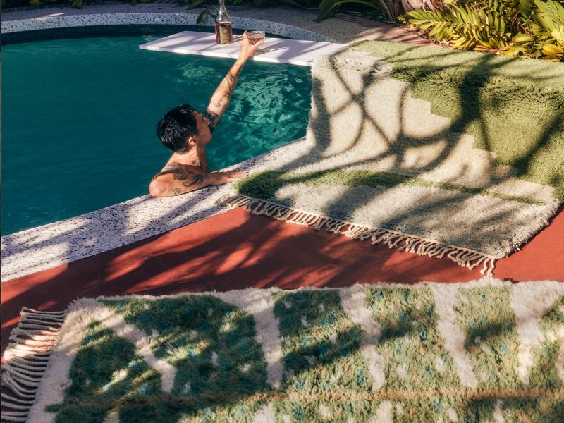 Monstera rug by pool. 