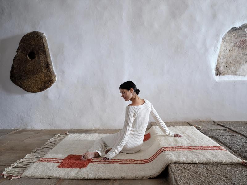 Through Line rug with woman. 