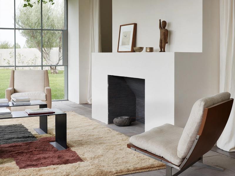 Fortification rug in front of fireplace. 