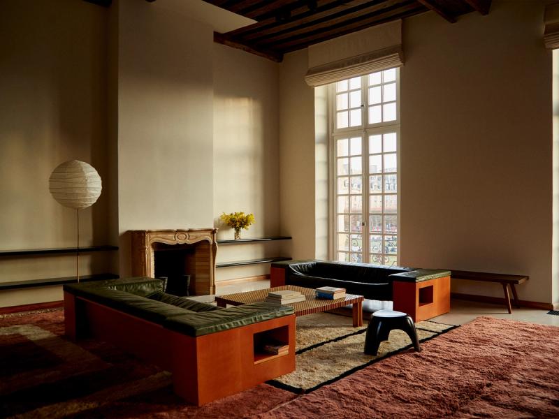 Layered rugs in living room. 