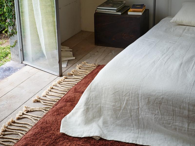 Replete rug under bed. 