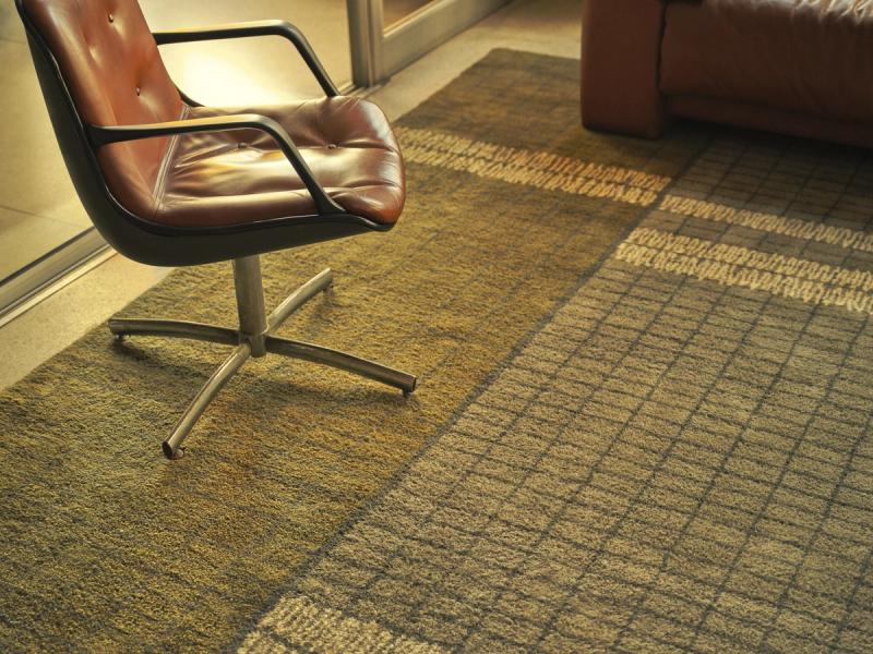 TIM-0312 rug on office floor under chair