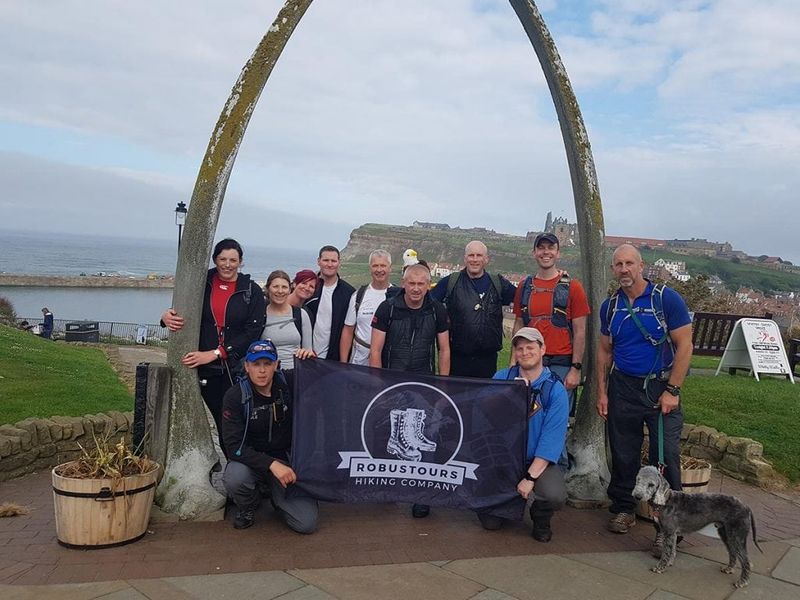 at the end of a hiking challenge in the UK