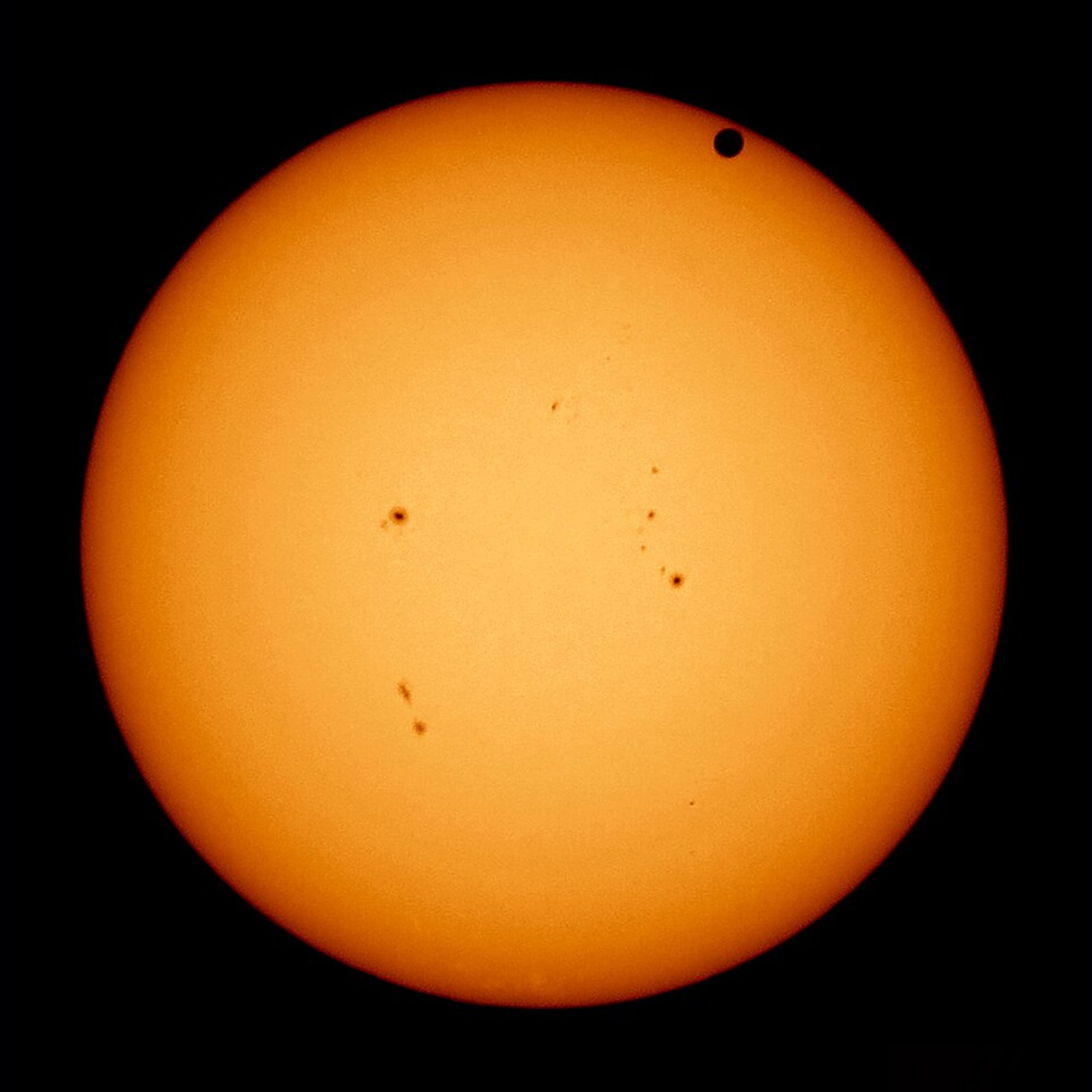 Large orange sphere, Venus.