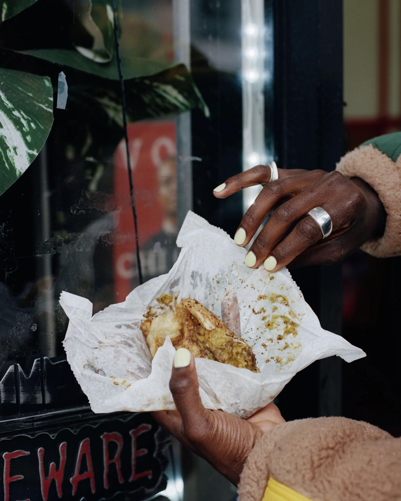 Devonn Francis' hands holding a curry.