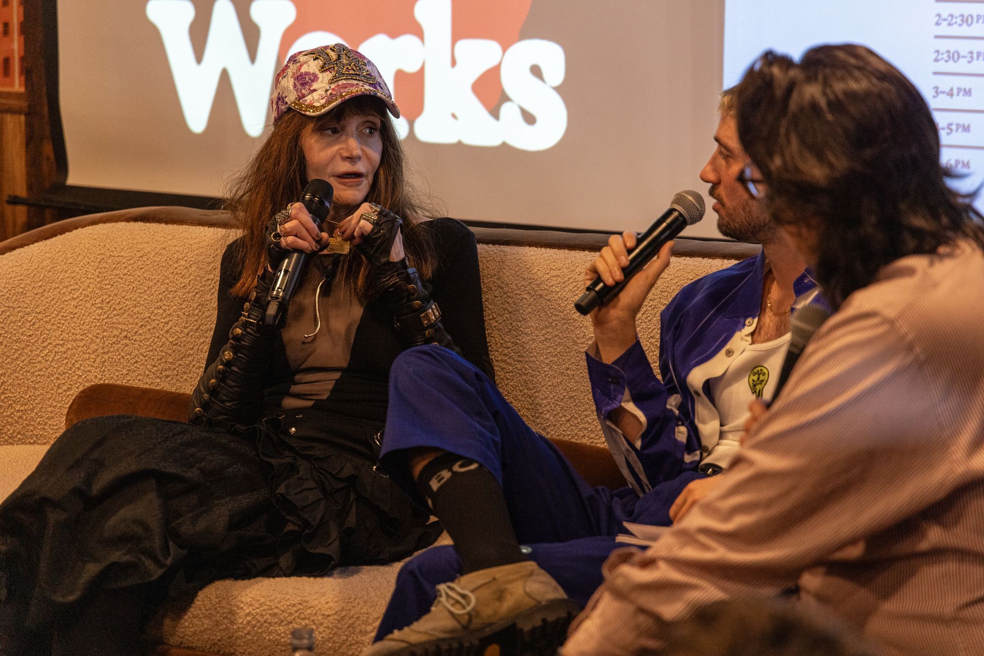 Laura Albert with Leigh Ledare, holding a bouquet of yellow roses, Steven Phillips-Horst, and Lily Marotta.