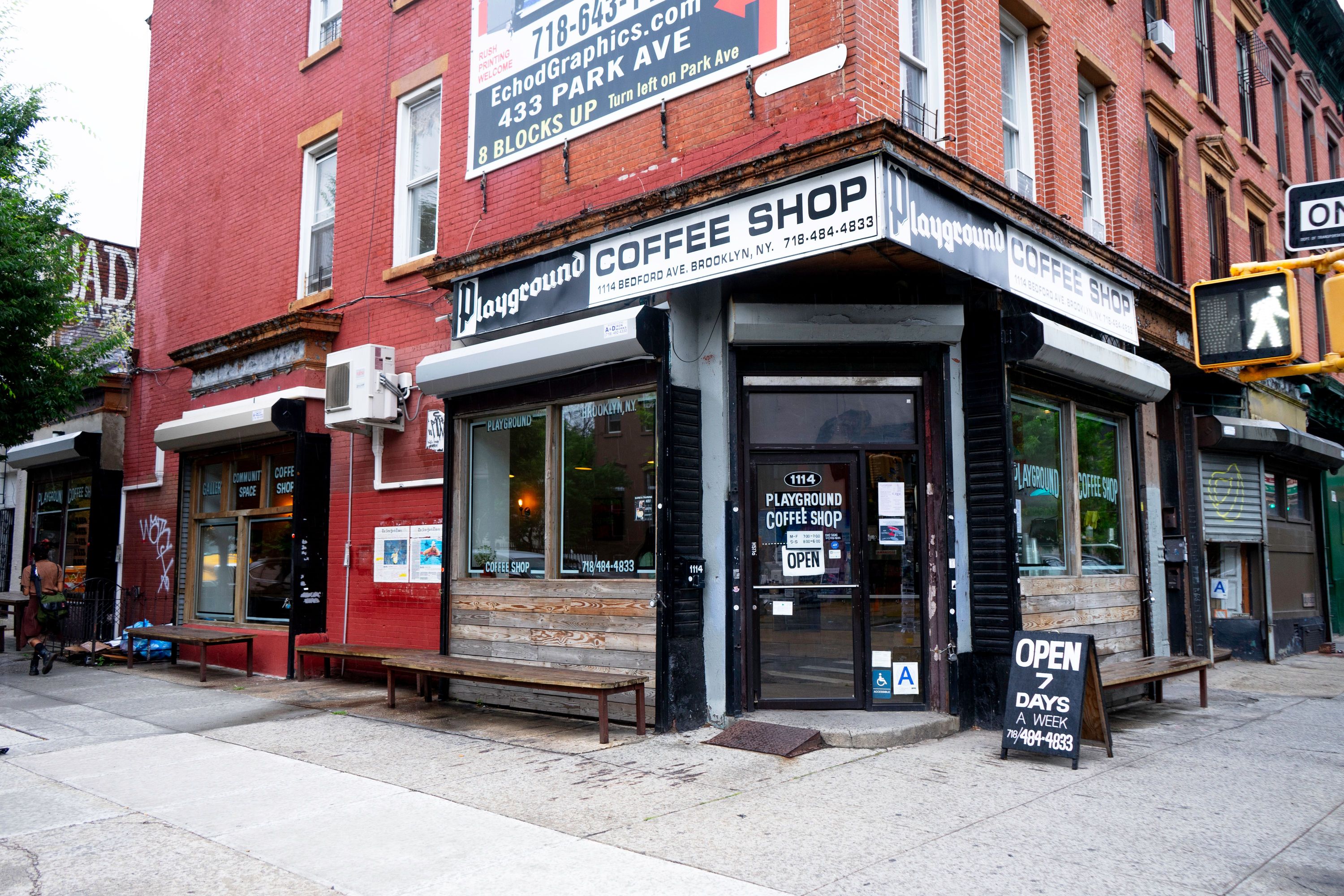 Photo of the Playground Coffee Shop on a street corner.
