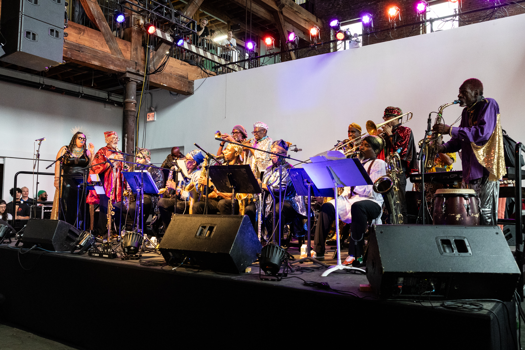 Marshall Allen performing with other members of the Sun Ra Arkestra on stage.