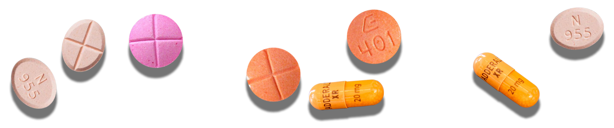 Adderall pills of different shapes, sizes, and colors arranged in a line.