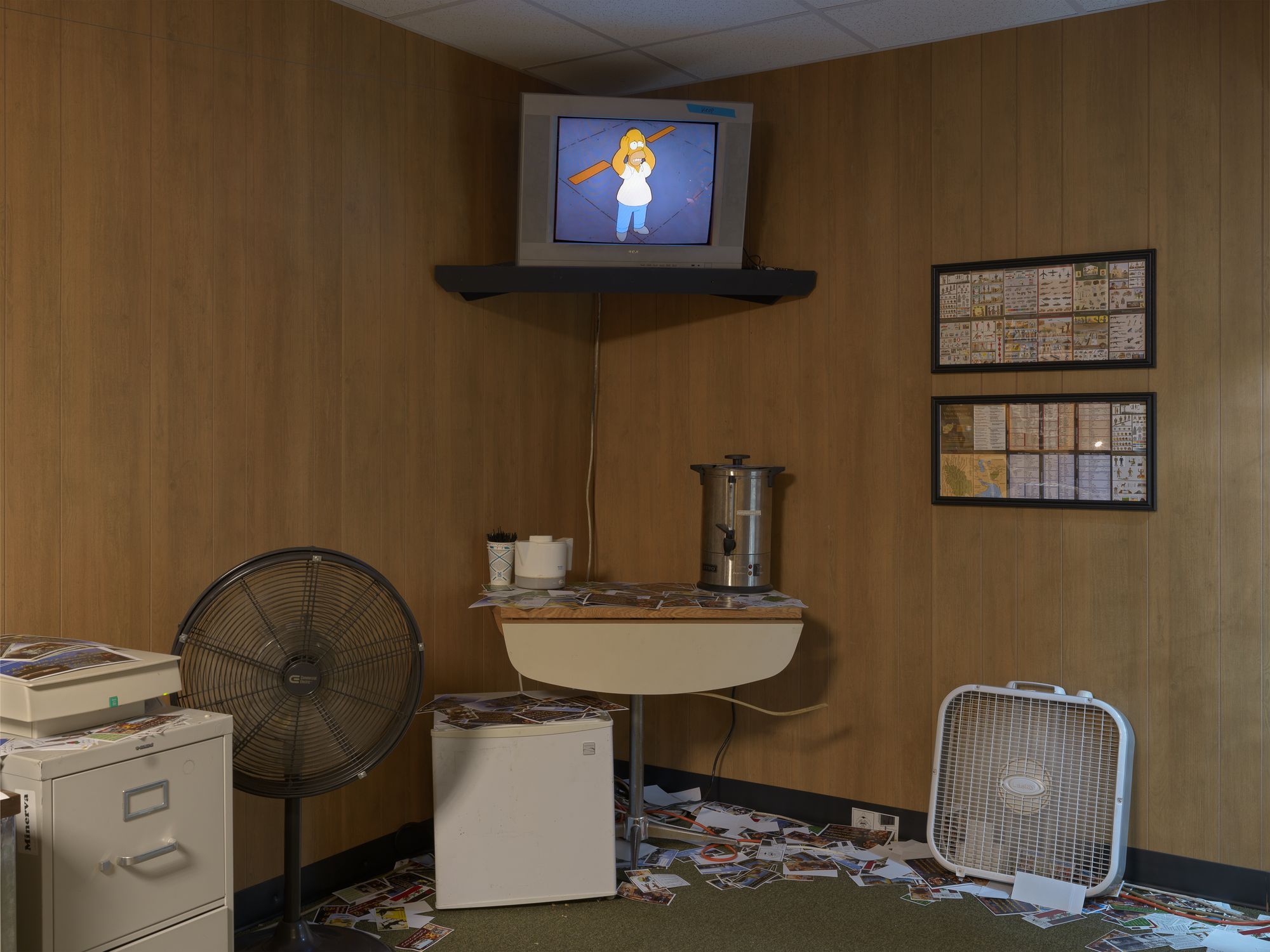 TV Screen showing the Simpsons at the corner of the exhibit.