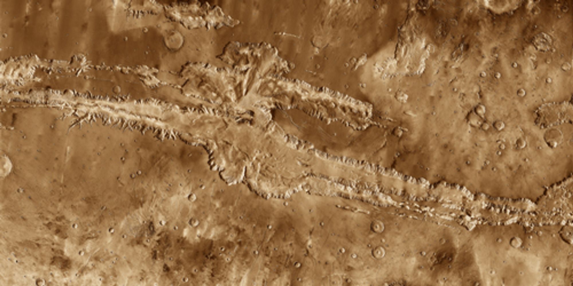 A colored photo of a canyon on the surface of Mars