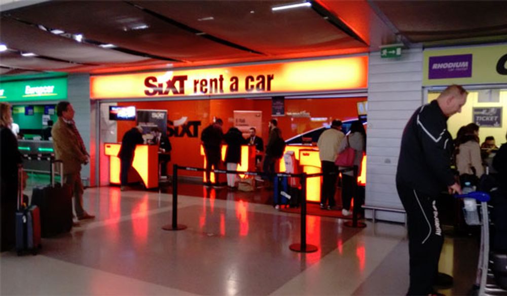 Photo of the Sixt Rent A Car counter in the Lisbon airport.