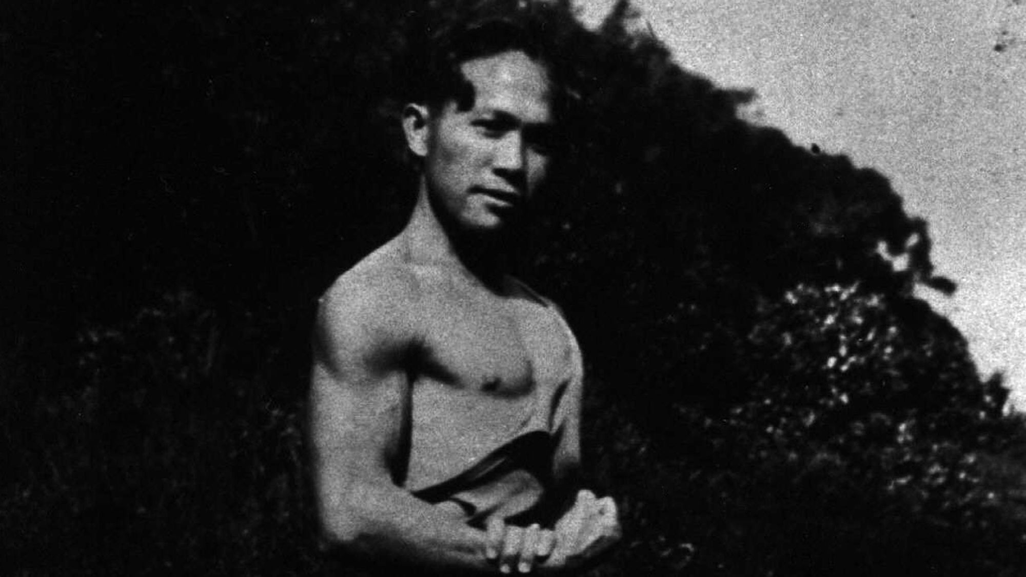 A black and white photograph of a young shirtless man who is Albert Banua, the director Anthony Banua-Simon's great grandfather