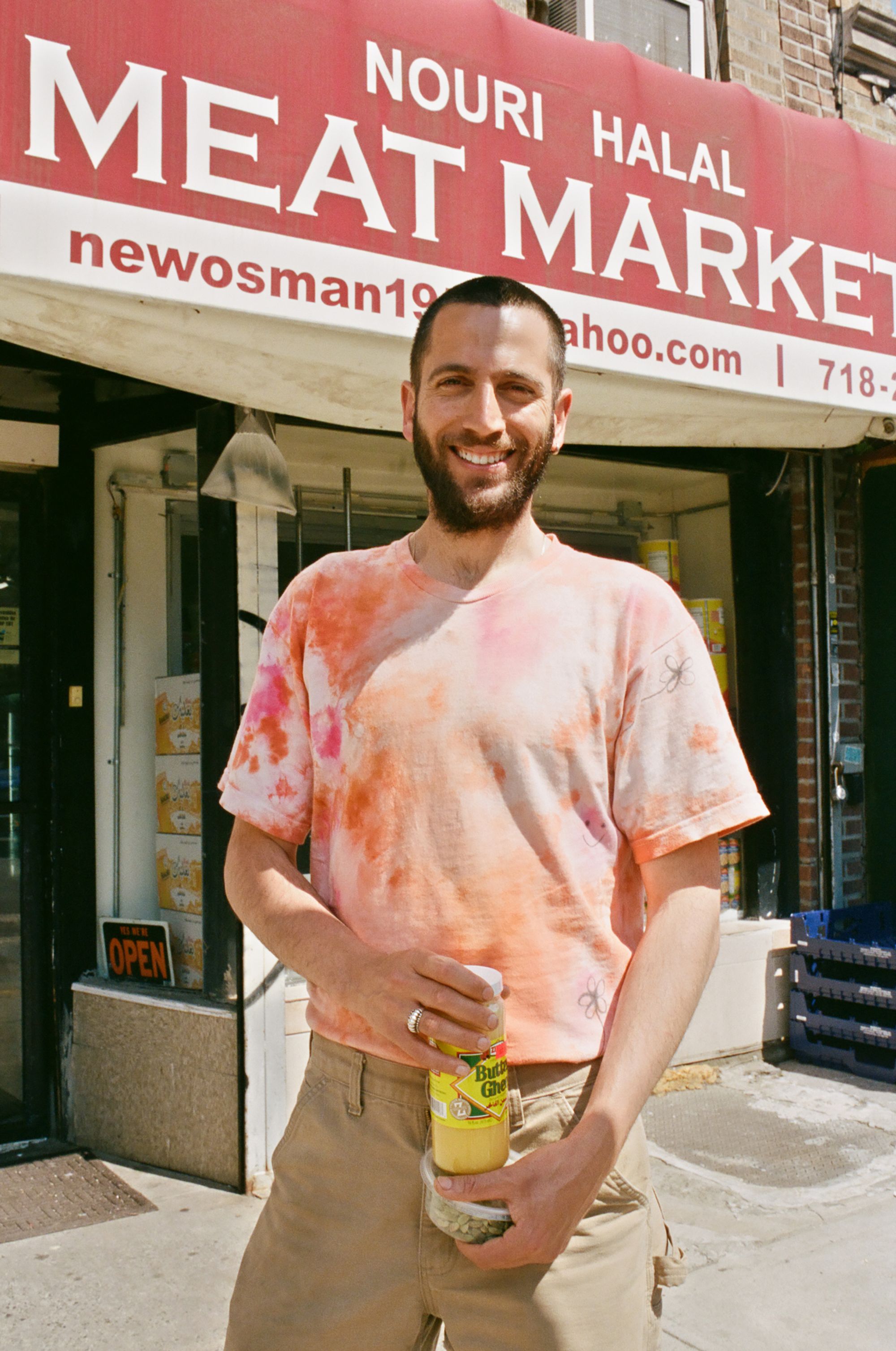 Loren Abramovitch stands in front of Halal Nouri Meat Market 