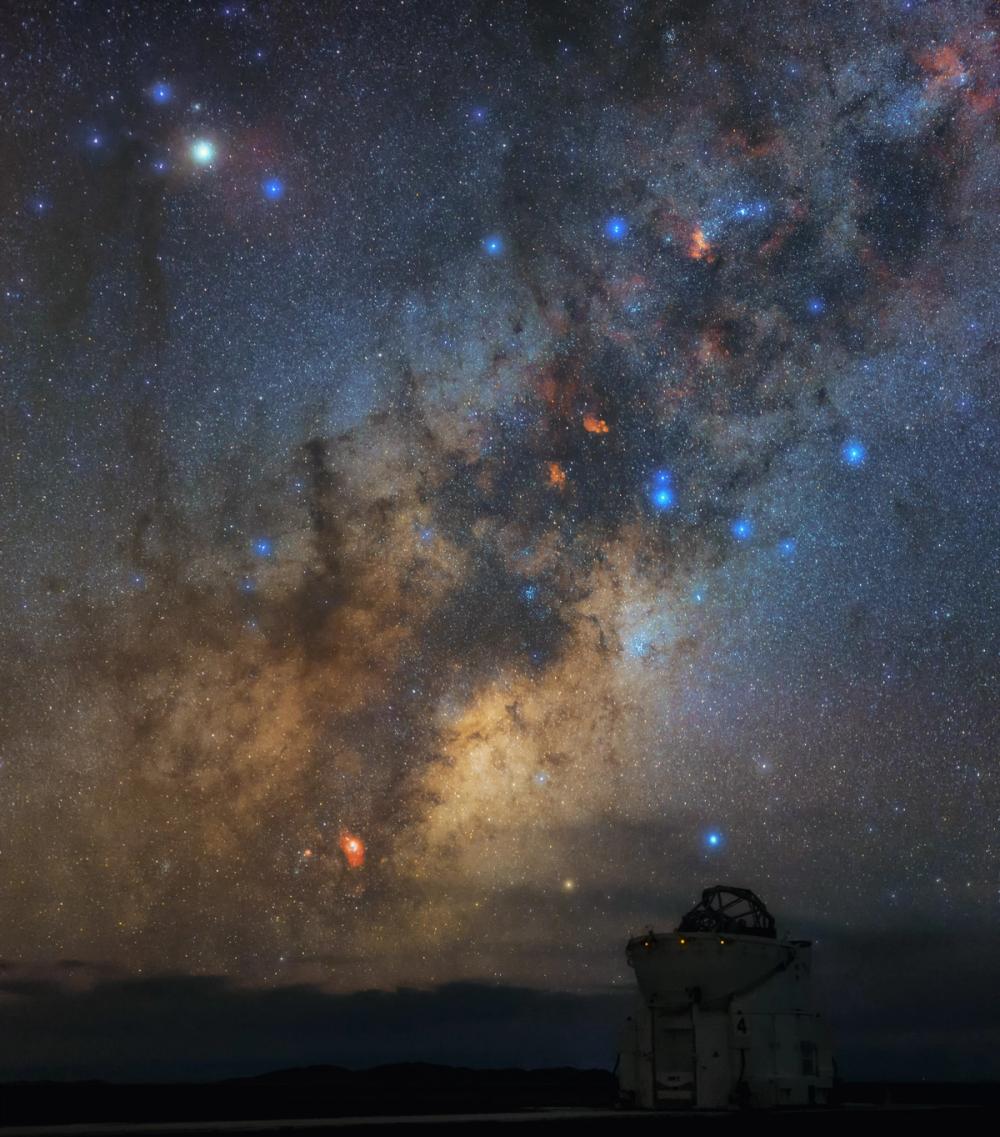 A telescope beneath a starry sky