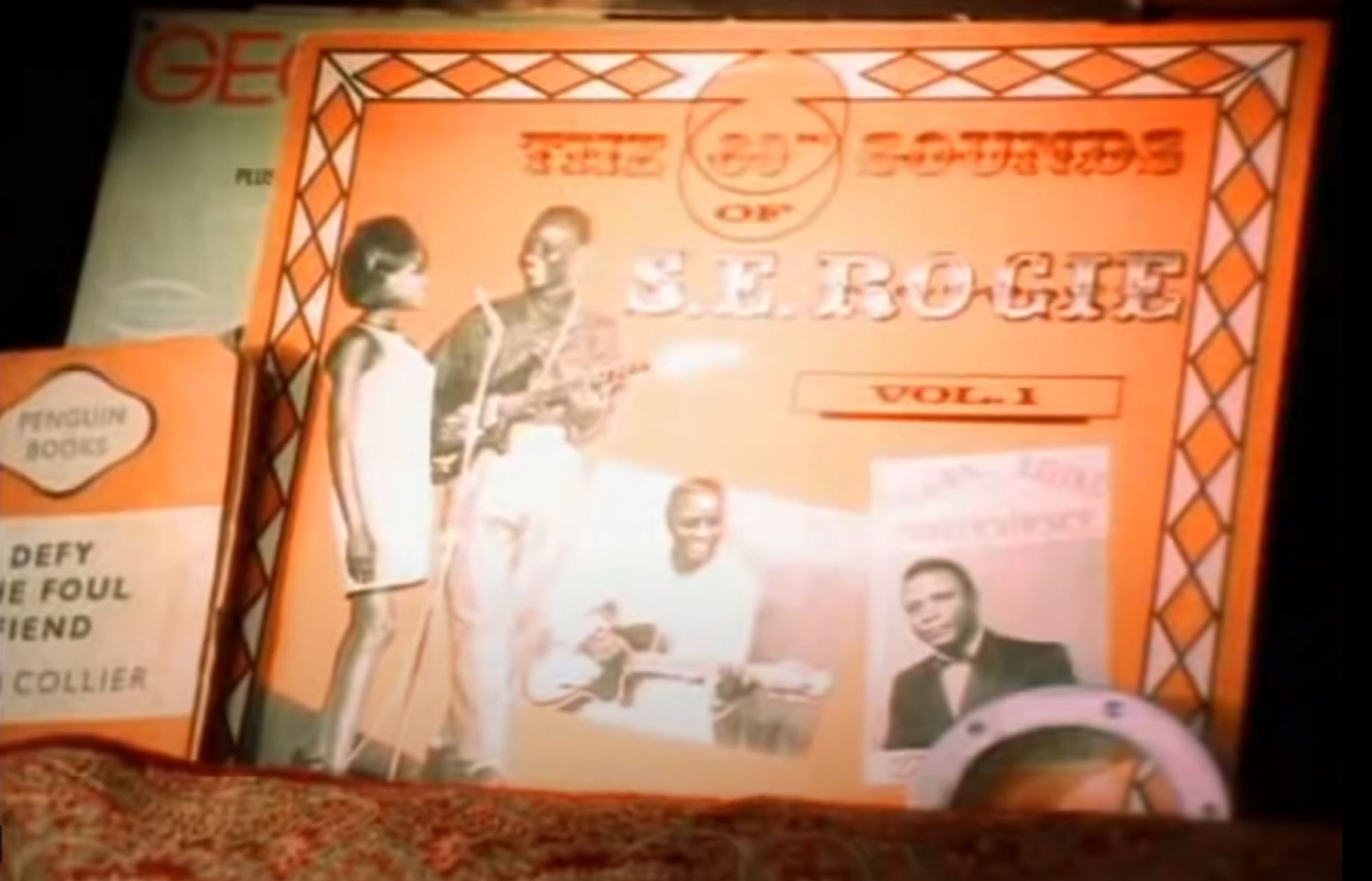 A screenshot of an orange vinyl cover with S.E. Rogie on it
