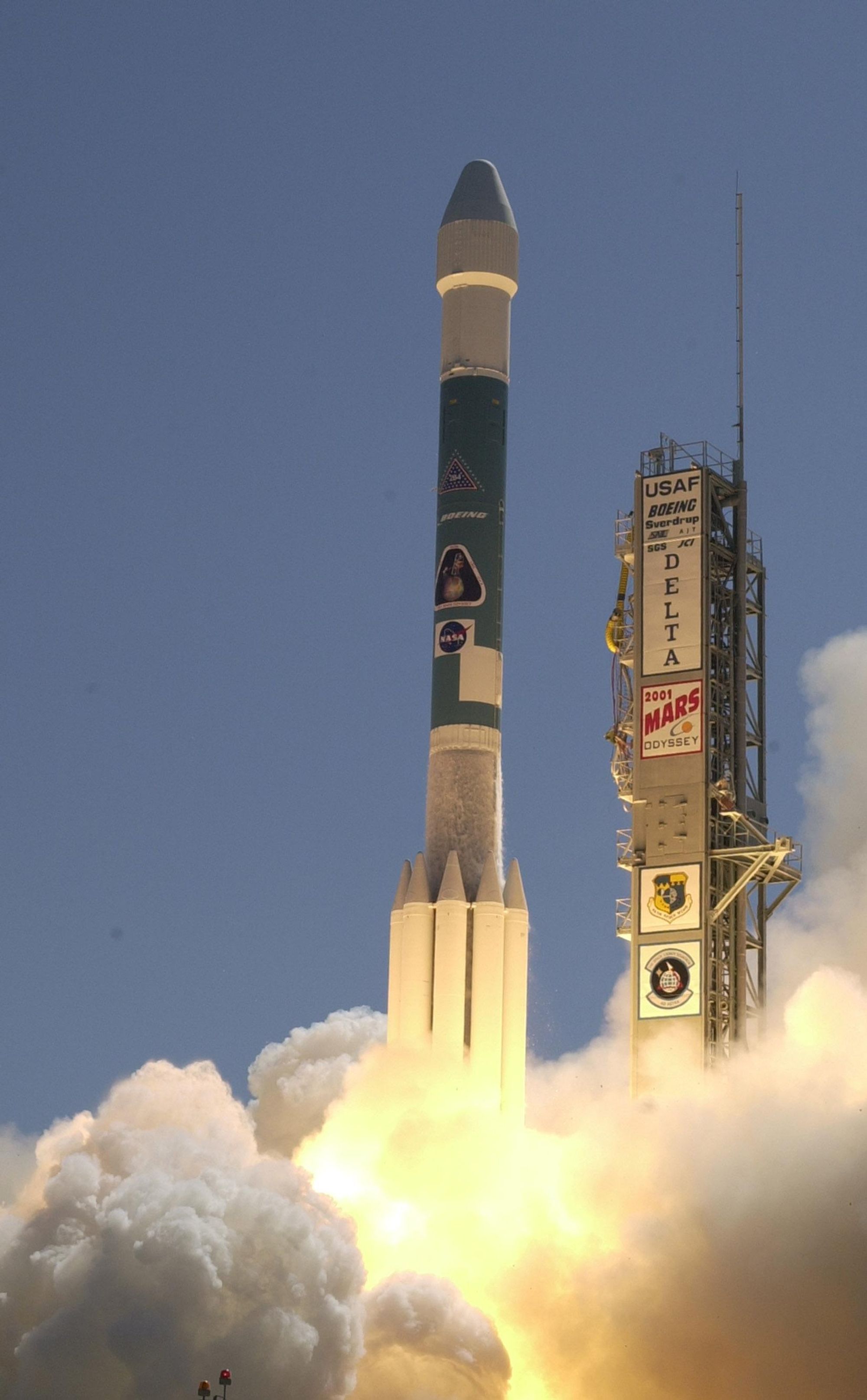 The Boeing Delta II rocket blasts into the clear blue sky, launching the 2001 Mars Odyssey spacecraft to orbit Mars.
