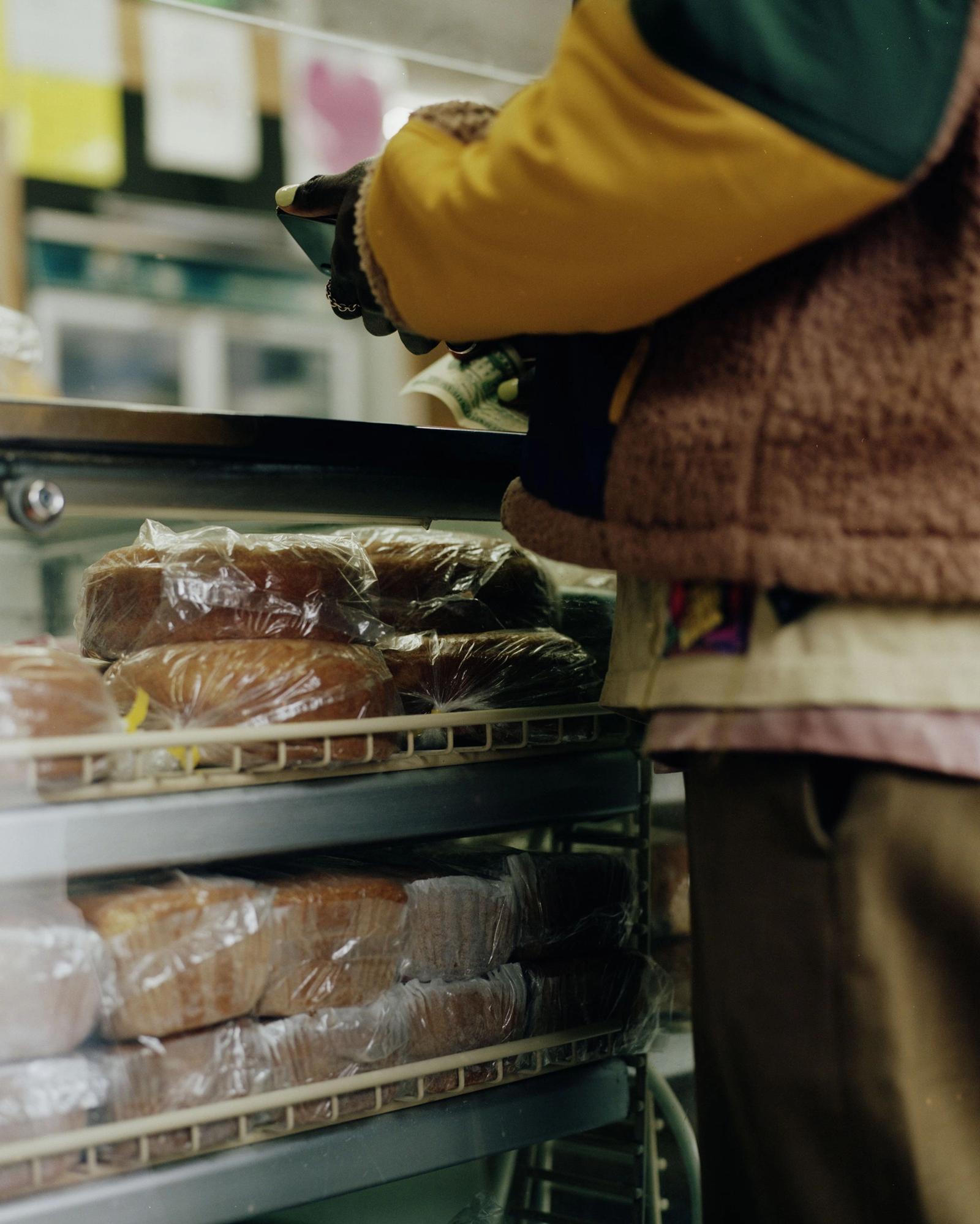 Devonne Francis purchasing bread.