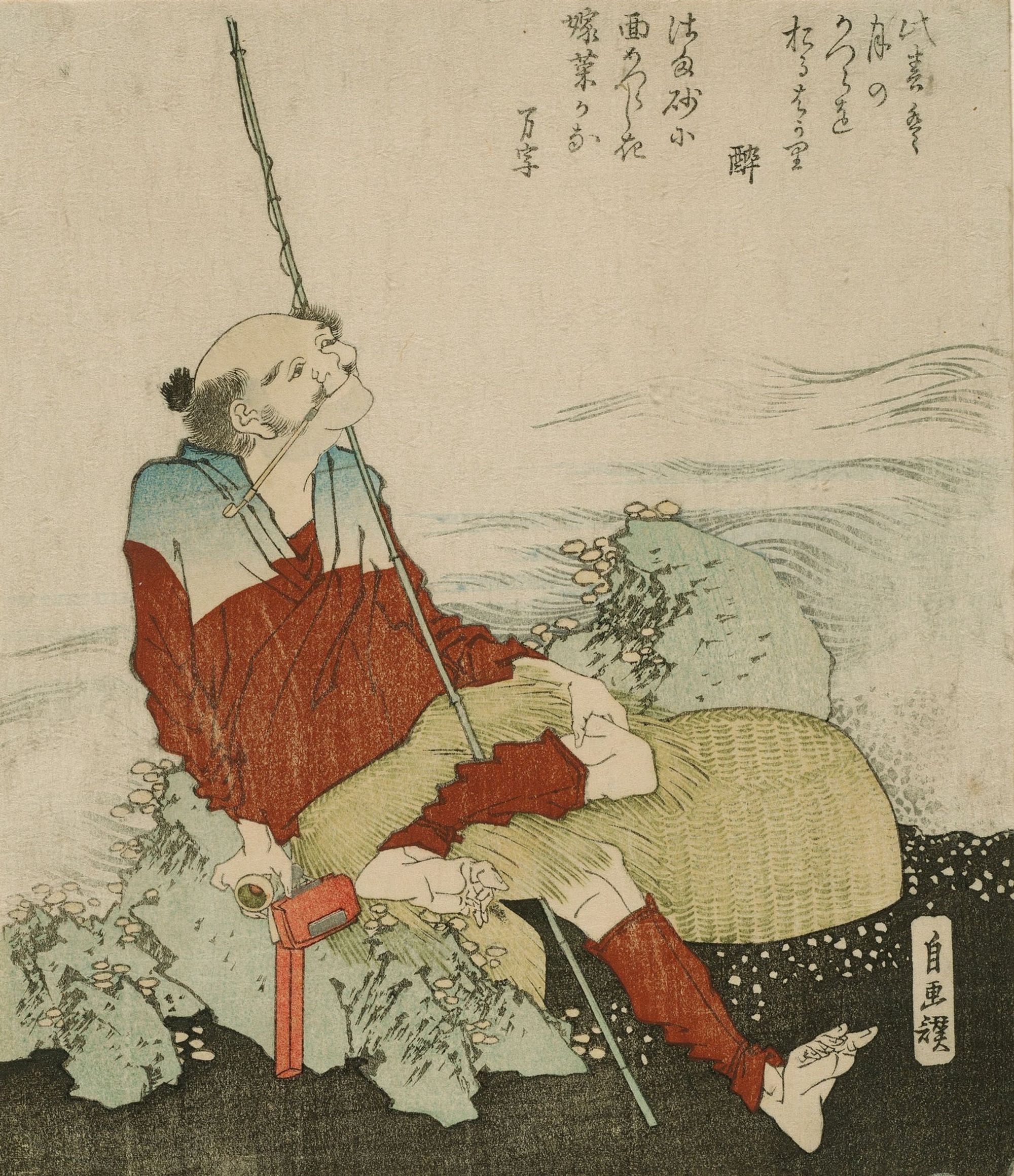 An old men grins while seated, resting his feet.