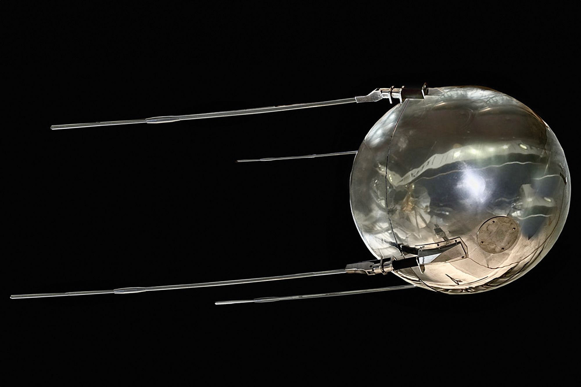 A full scale shell of the Sputnik in black space 