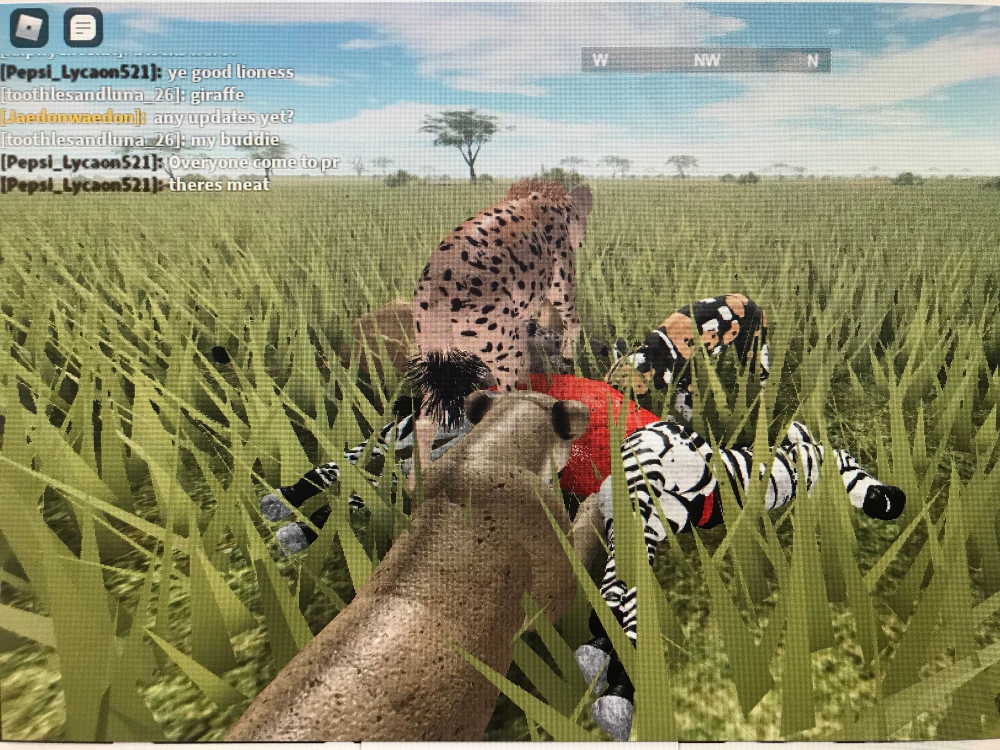 Screenshot of V being devoured by a lion, cheetah, and wild dog in a pixelated prairie with a hazy sky overhead.
