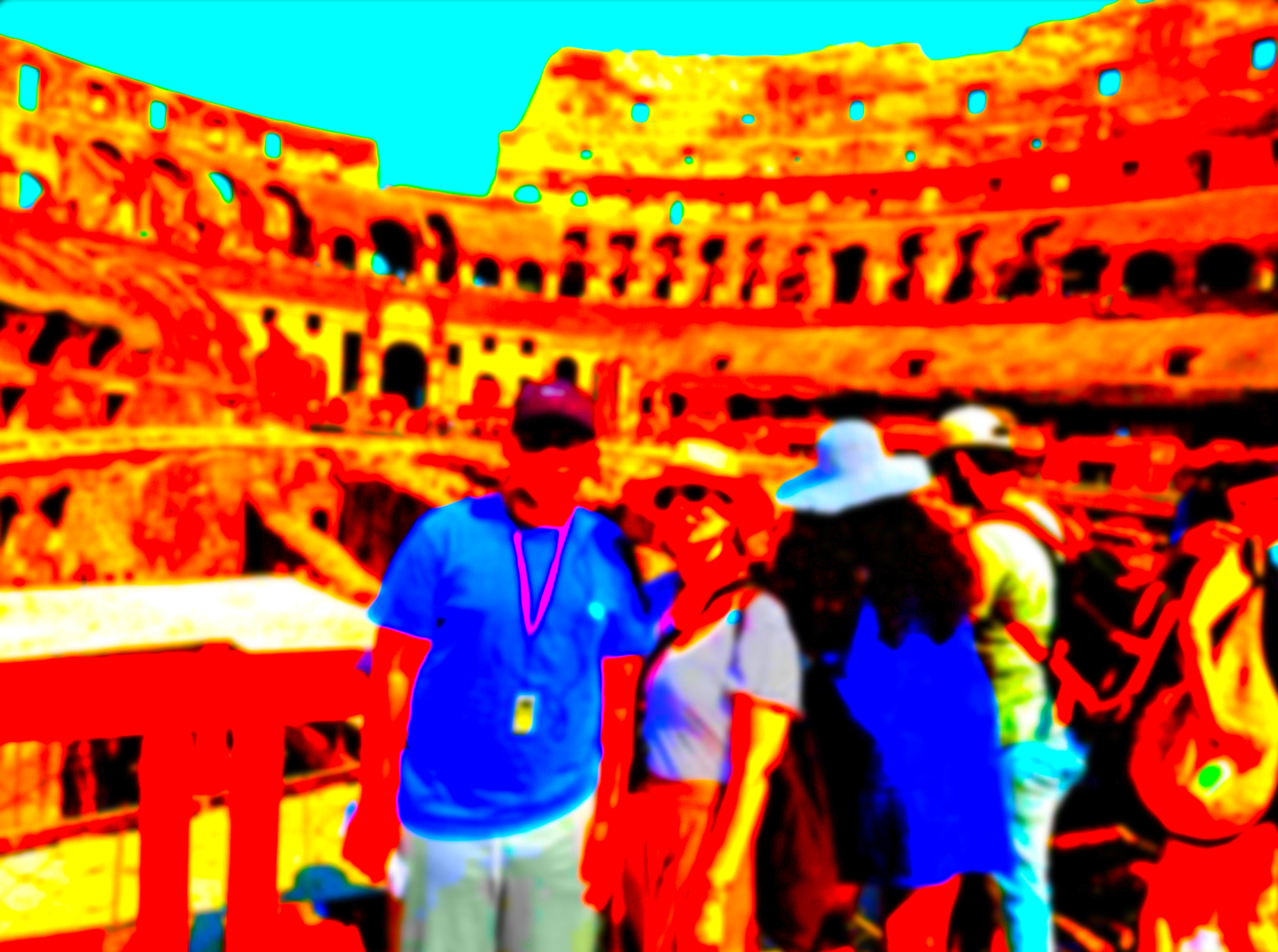 A mother and son stand in the ruins of the colosseum, posing for a portrait.