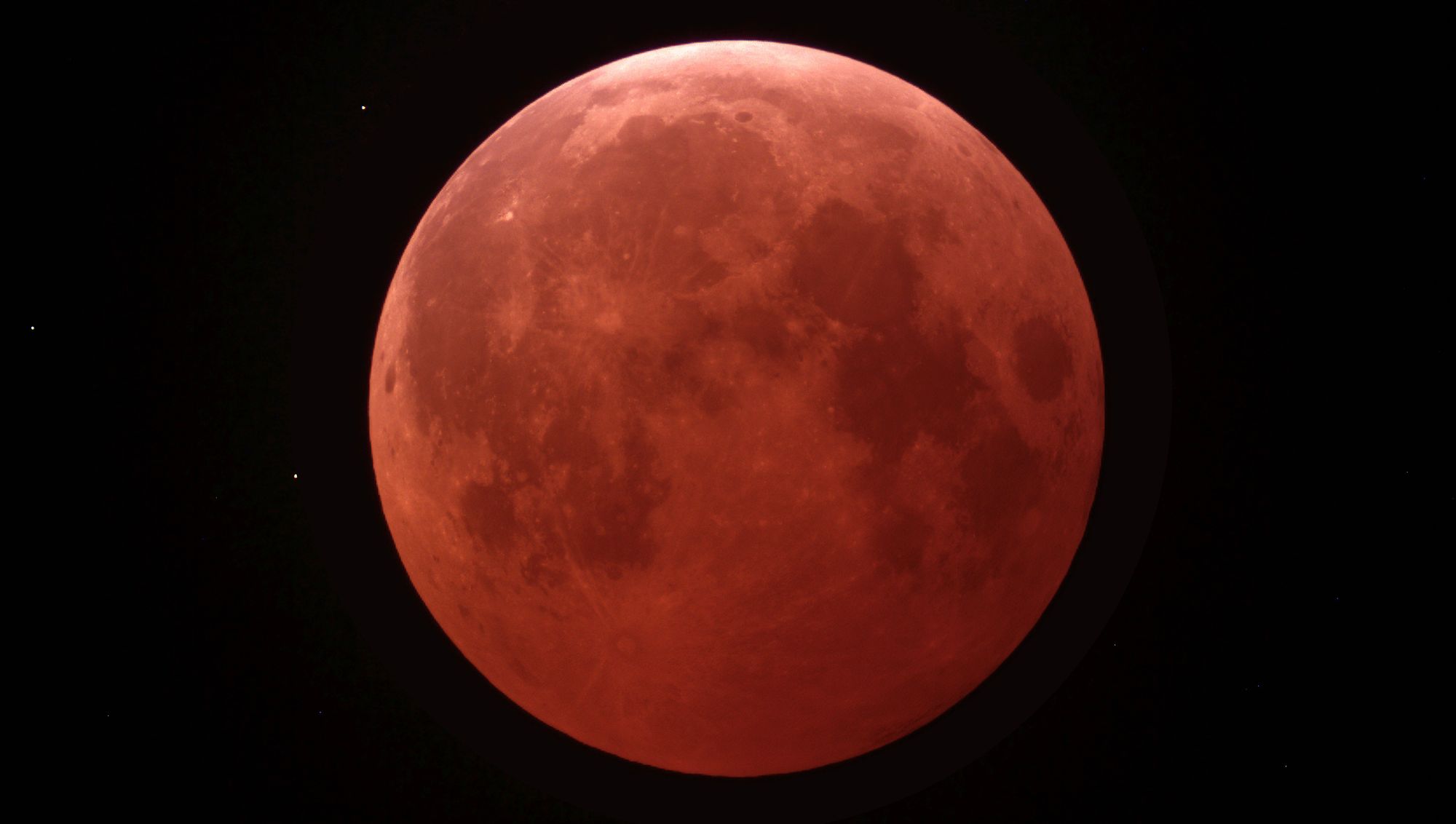 A blood-red Full Moon, seen amidst a total lunar eclipse. 