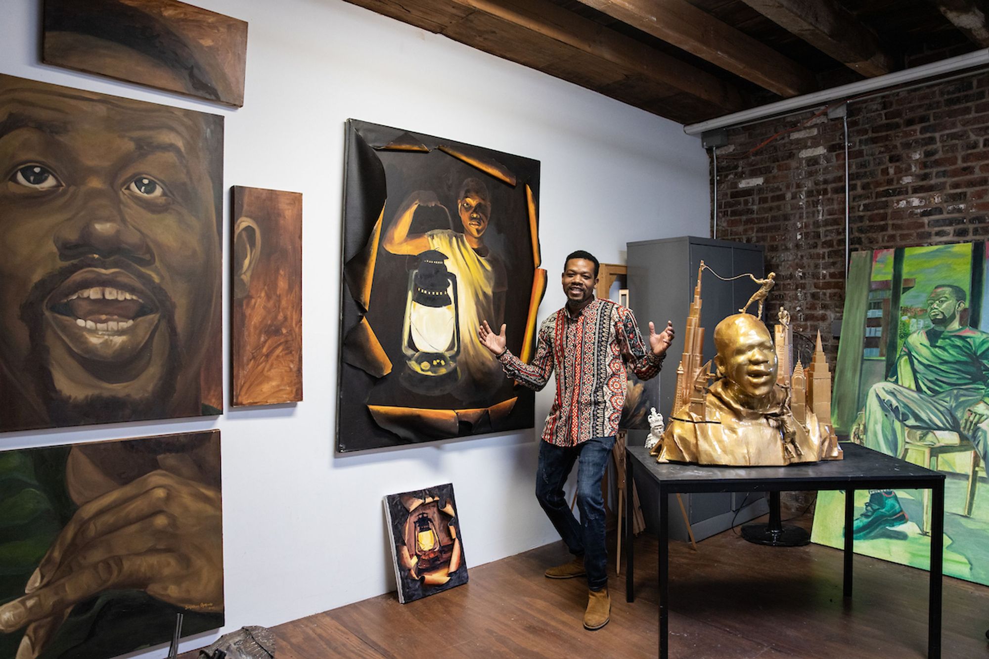Jonathan Ojekunle with his art