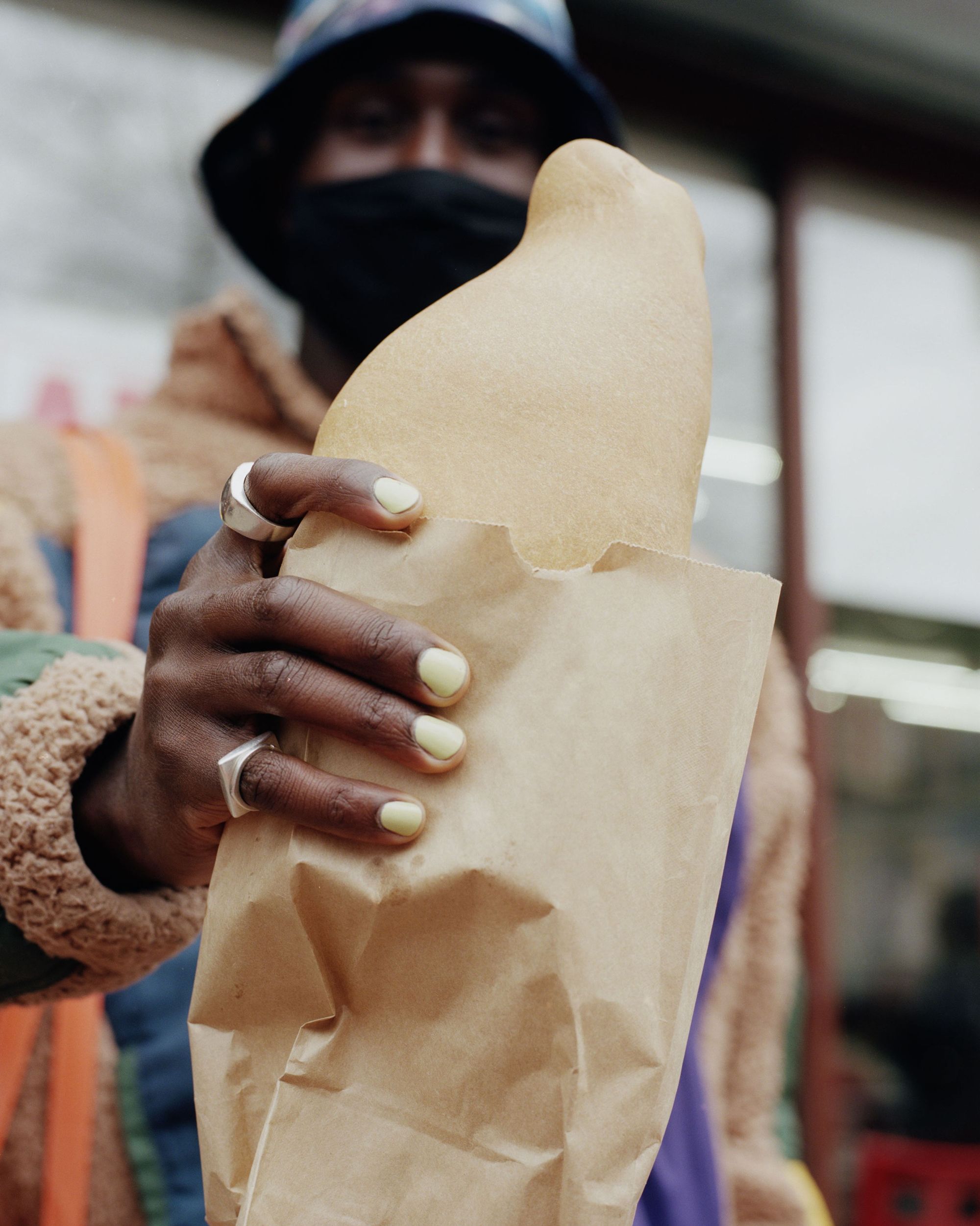 Devonn Francis holding an empanada. 