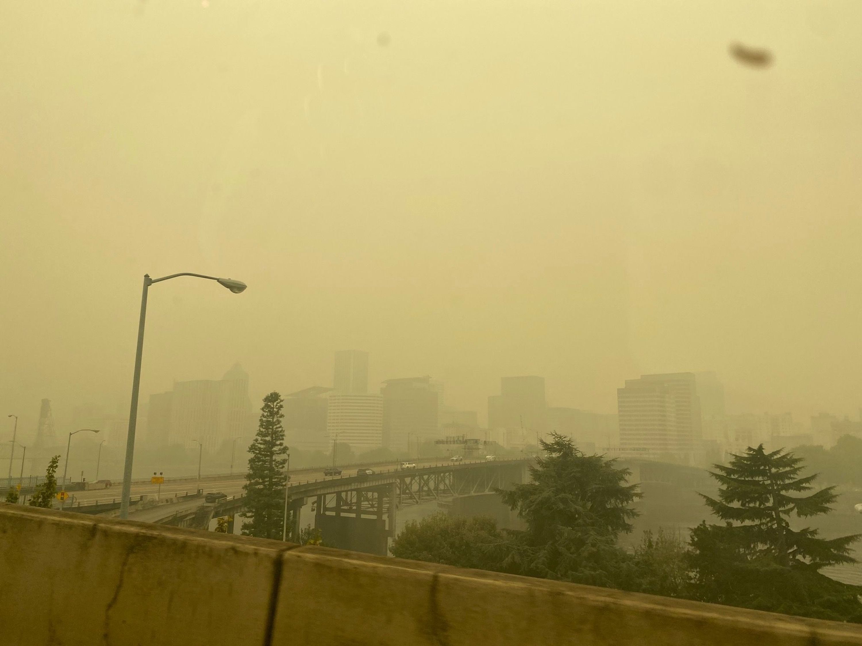Smoke-filled, yellow hazy view of downtown Portland