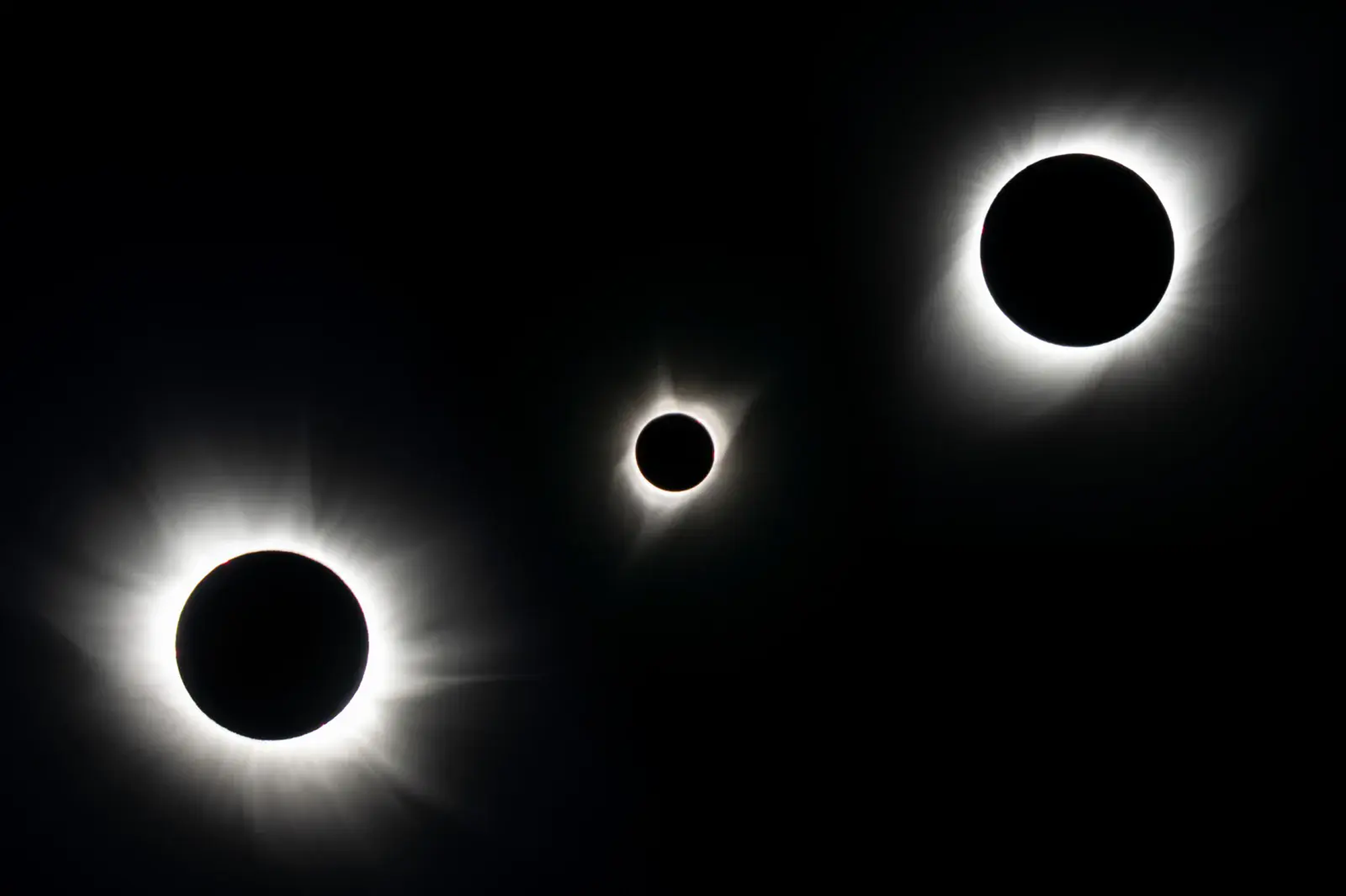 Three different total solar eclipses, with the smallest moon in the middle