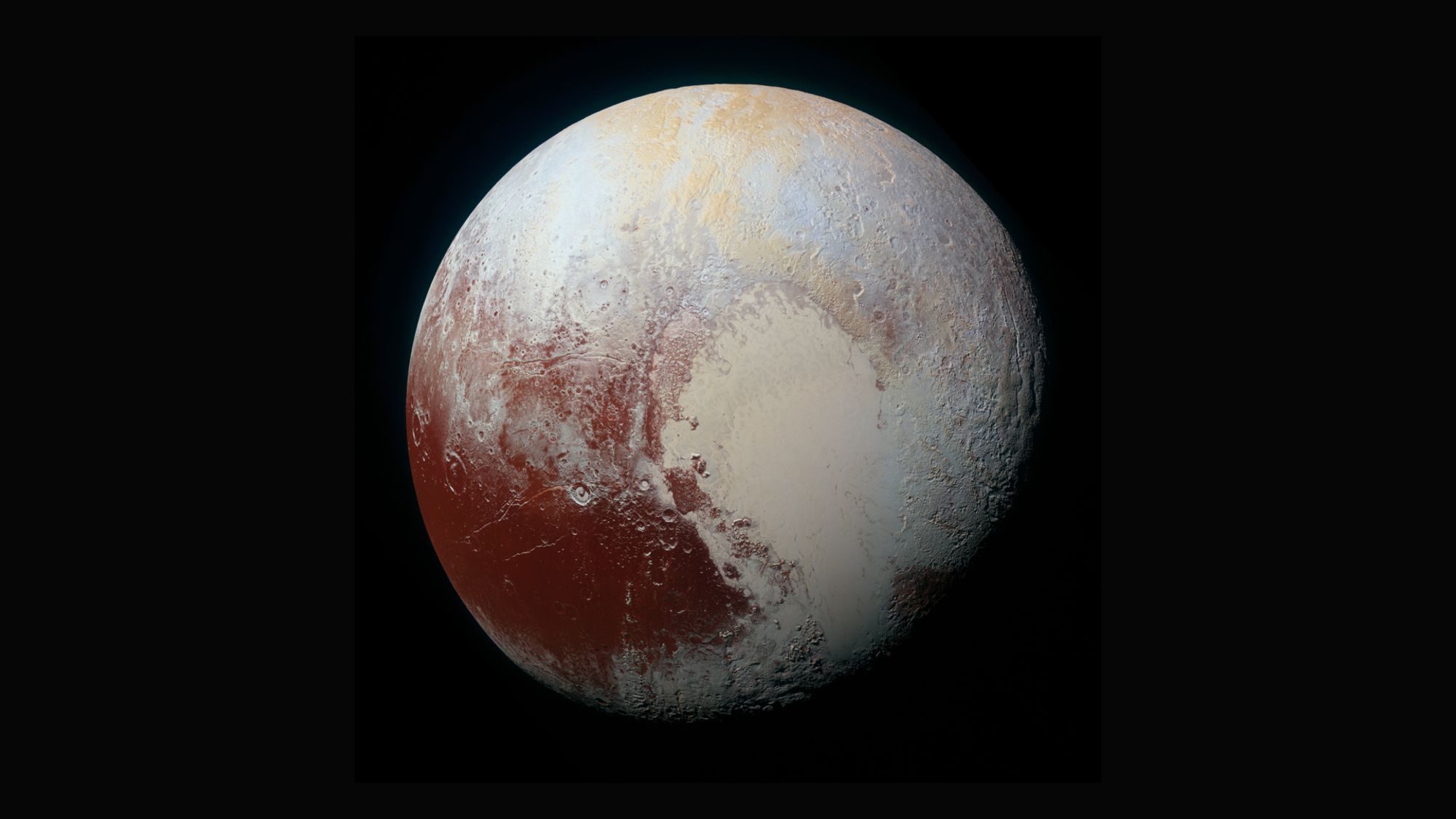 The surface of distant planet Pluto in spectacular, colored detail.  