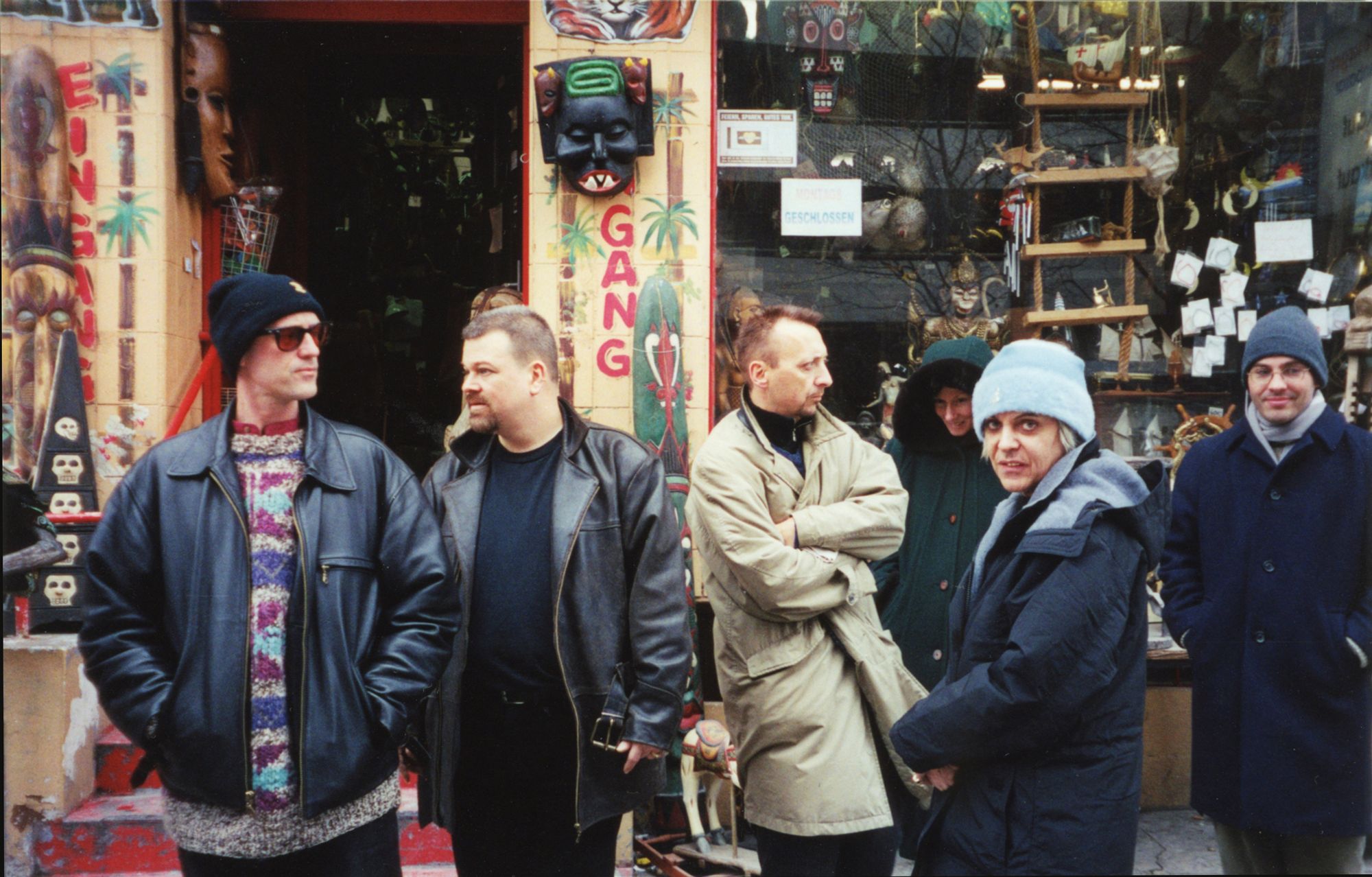 Genesis and the band in front of a display window