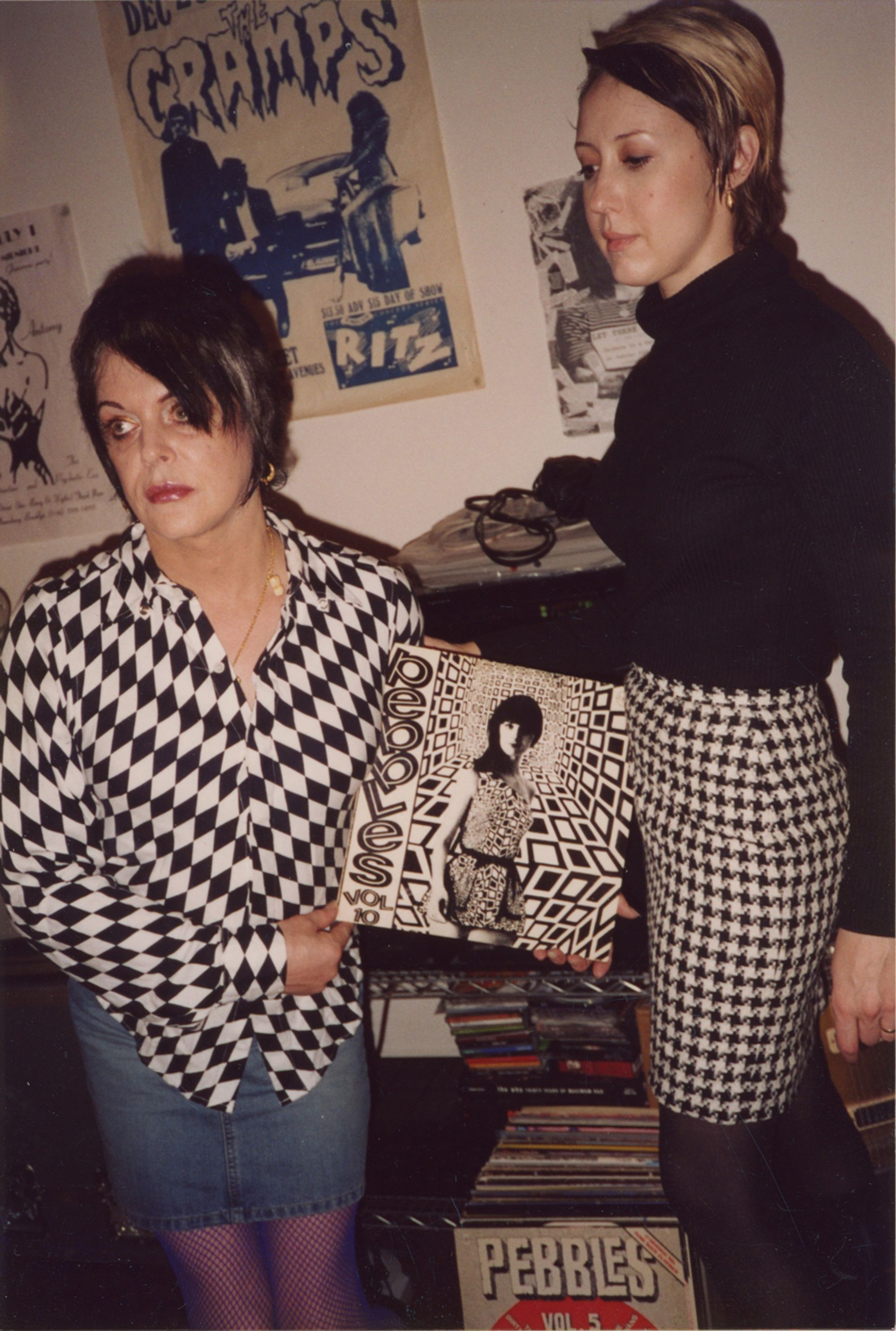 Genesis and Lady Jaye holding an album cover