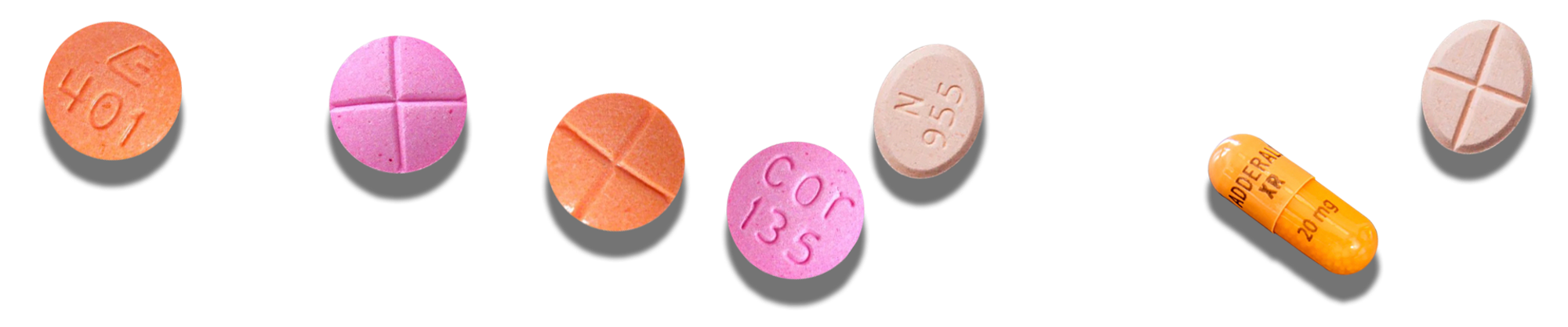 Adderall pills of different colors and sizes arranged in a pattern