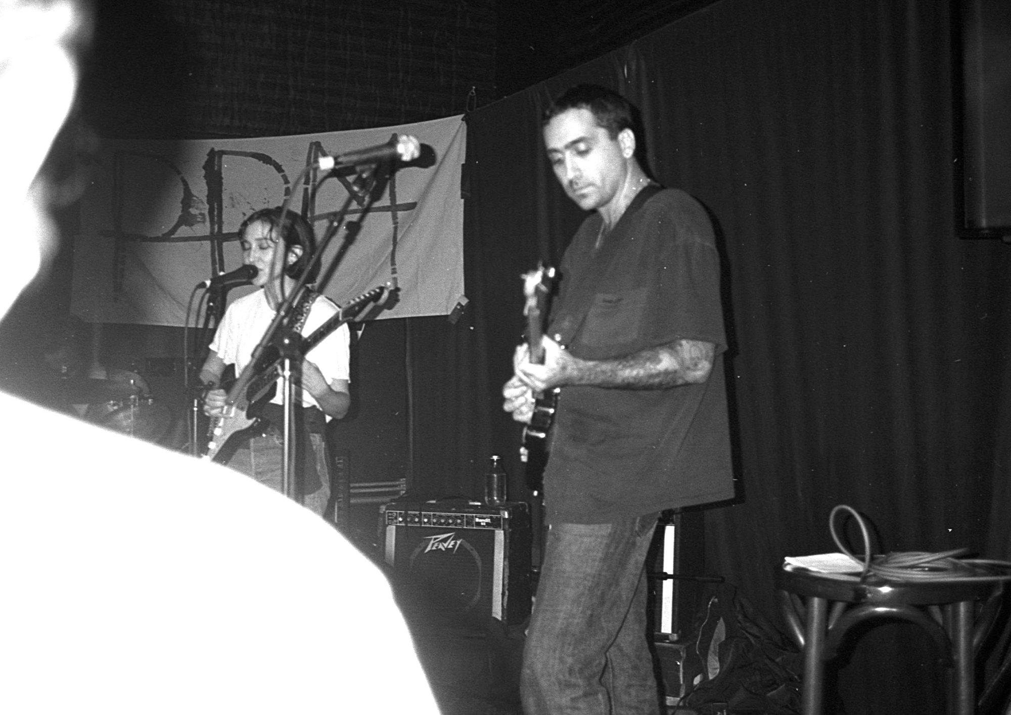 Black and white image of band performing on stage