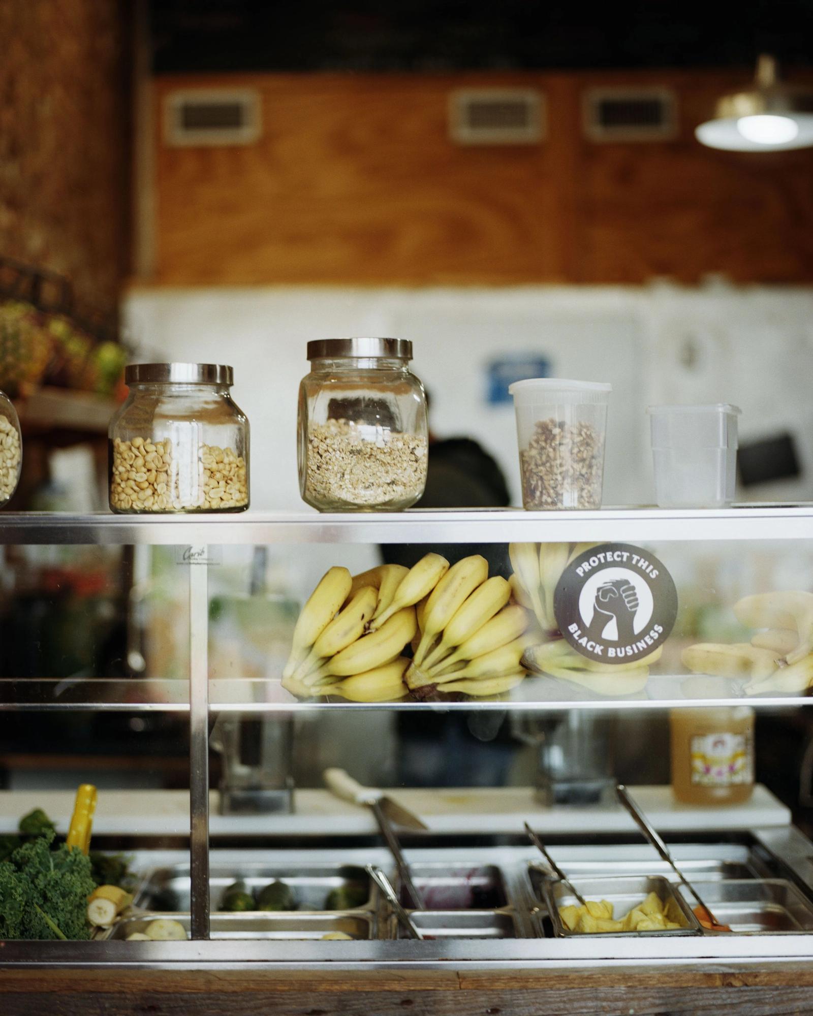 Grains and bananas artfully arranged on shelves.