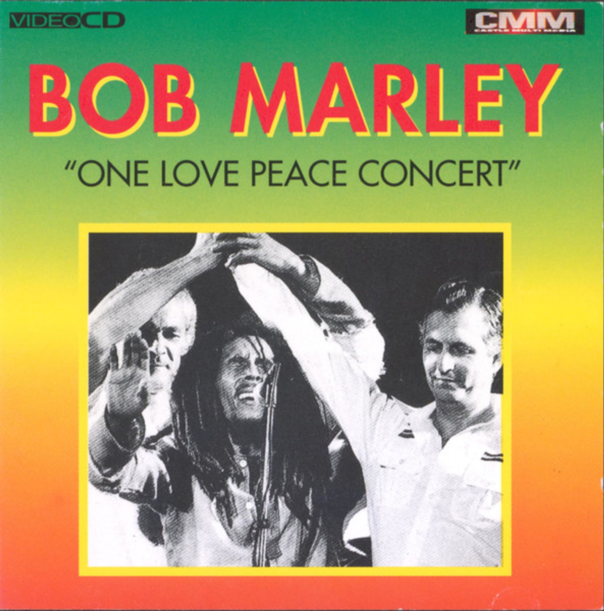 A black and white image of Bob Marley on stage, framed in a colorful frame of green, yellow, and orange with the text "Bob Marley: One Love Peace Concert" written across it.