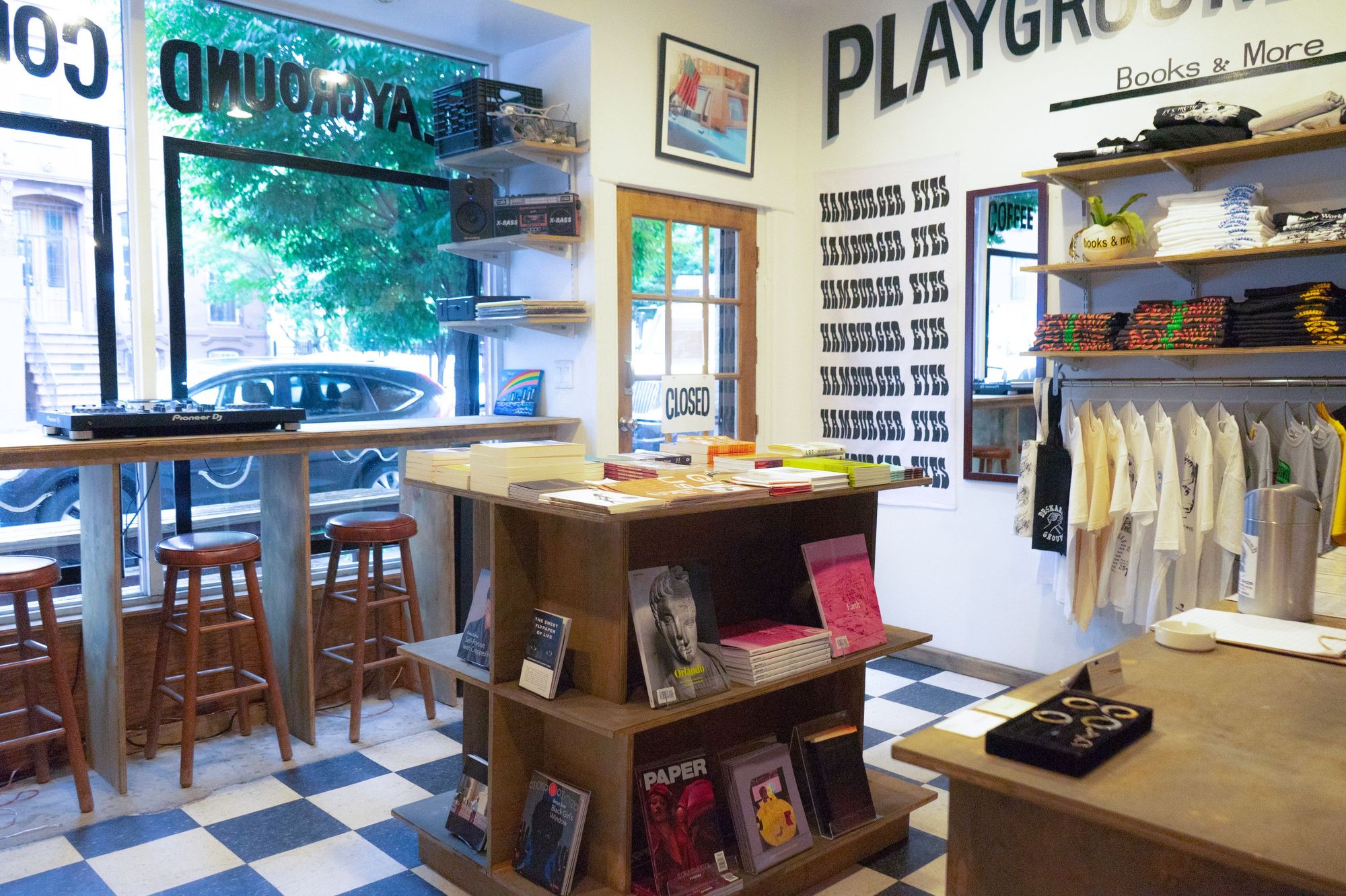 Interior of Playground annex with books and T-shirt displays. 