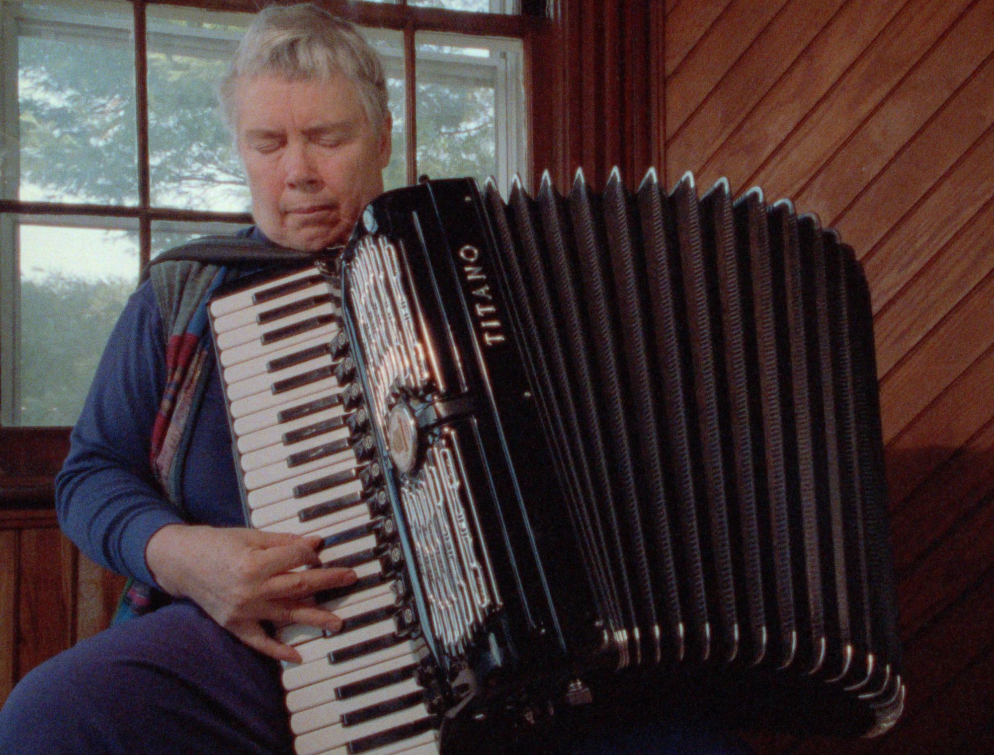 A man plays an instrument.