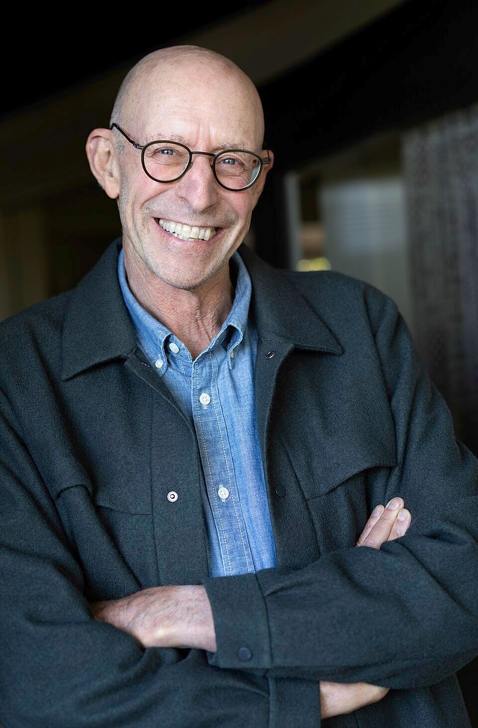 Author Headshot alongside book cover of A World Appears by Michael Pollan