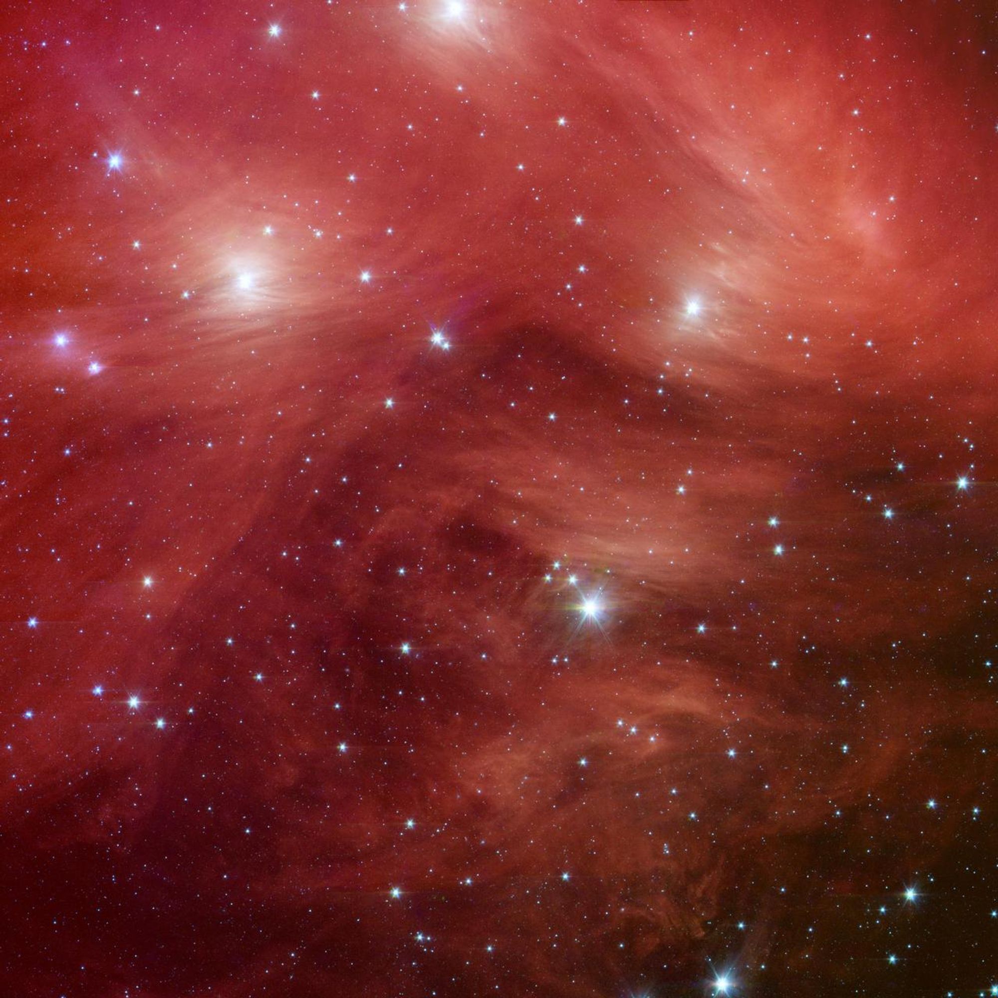 An image of a star cluster washed in red 