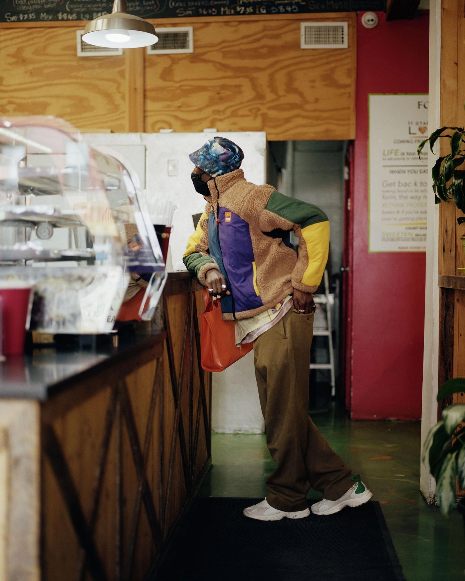 Devonn Francis standing at a food counter.