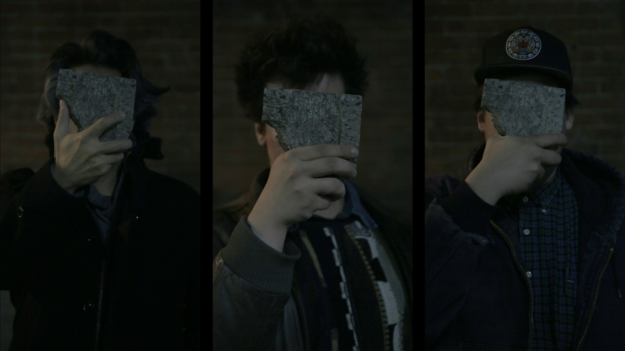 Three portraits arranged in a triptych, with people holding rocks to obscure their faces.