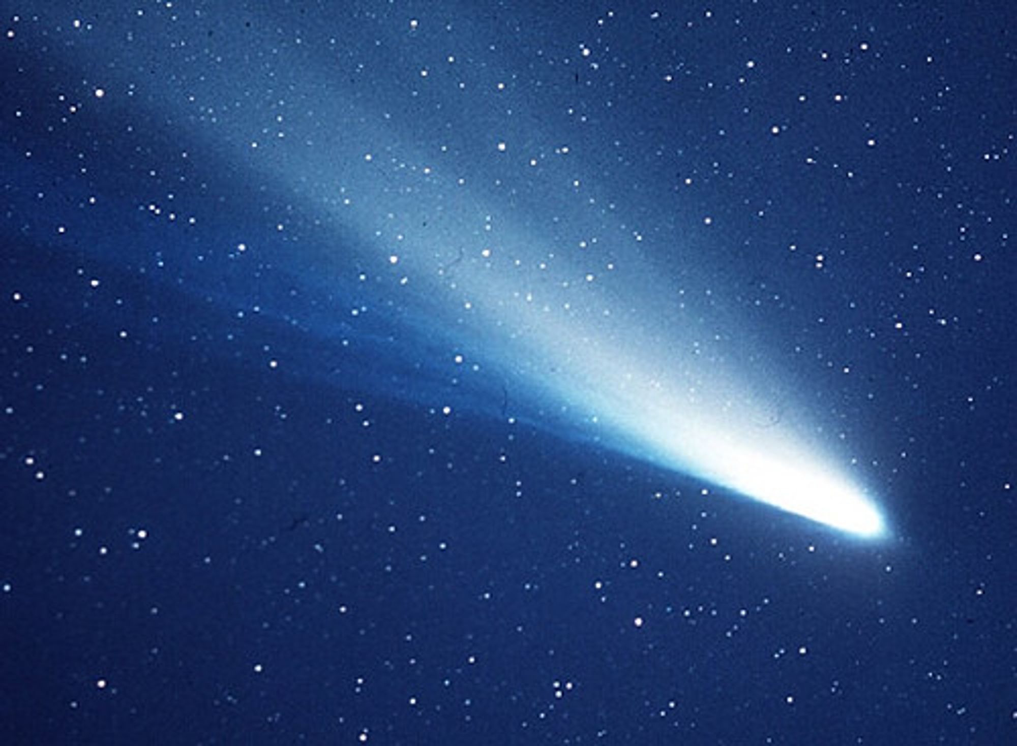 A blue comet streaking across the night sky