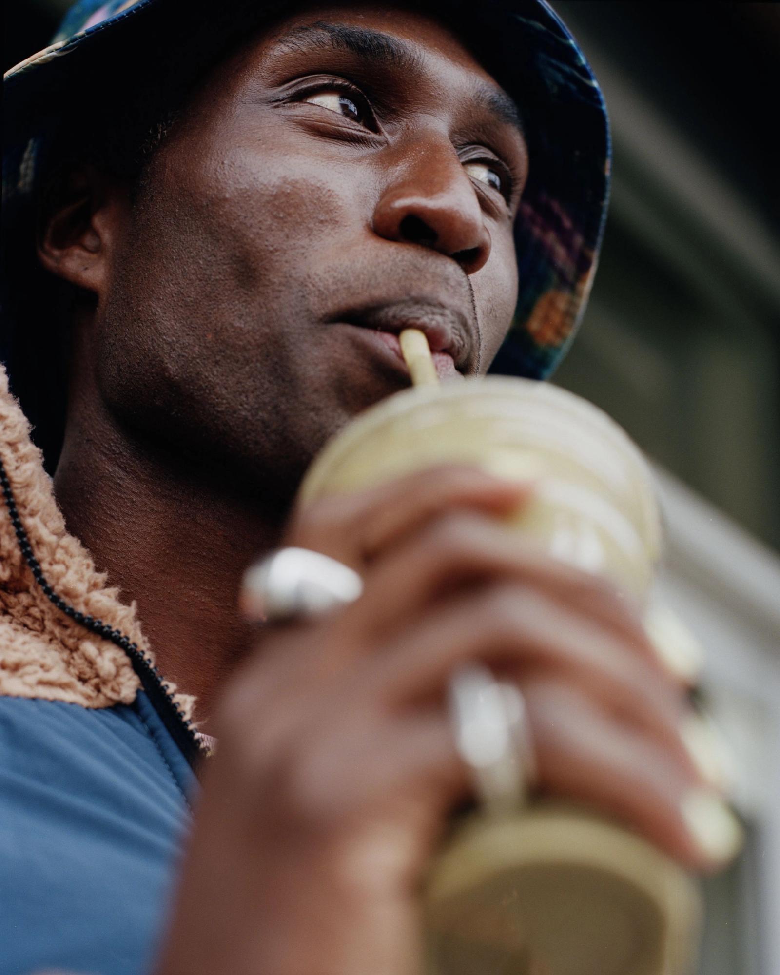 Devonn Francis drinking from a plastic cup.