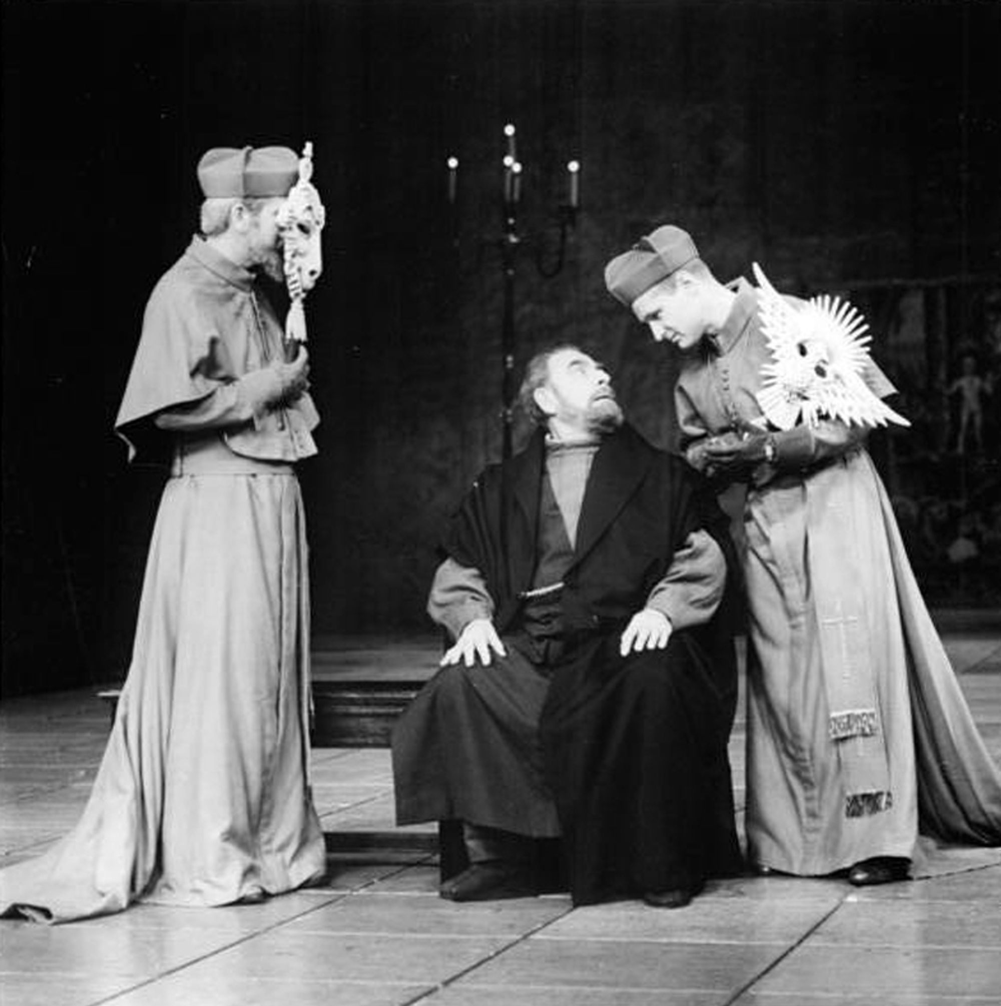 Three actors on stage in the play Life of Galileo
