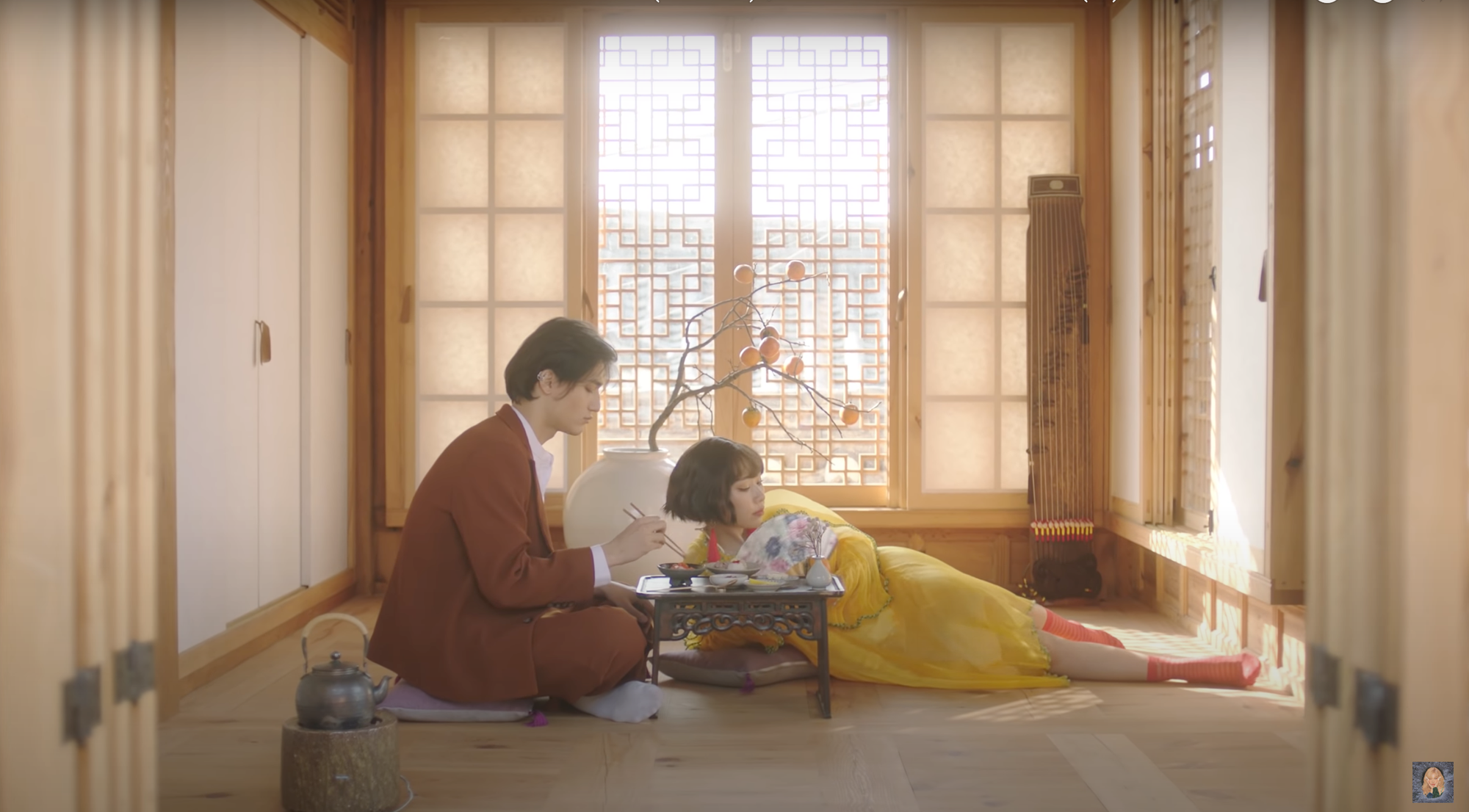 A couple sitting on the floor of a Japanese house